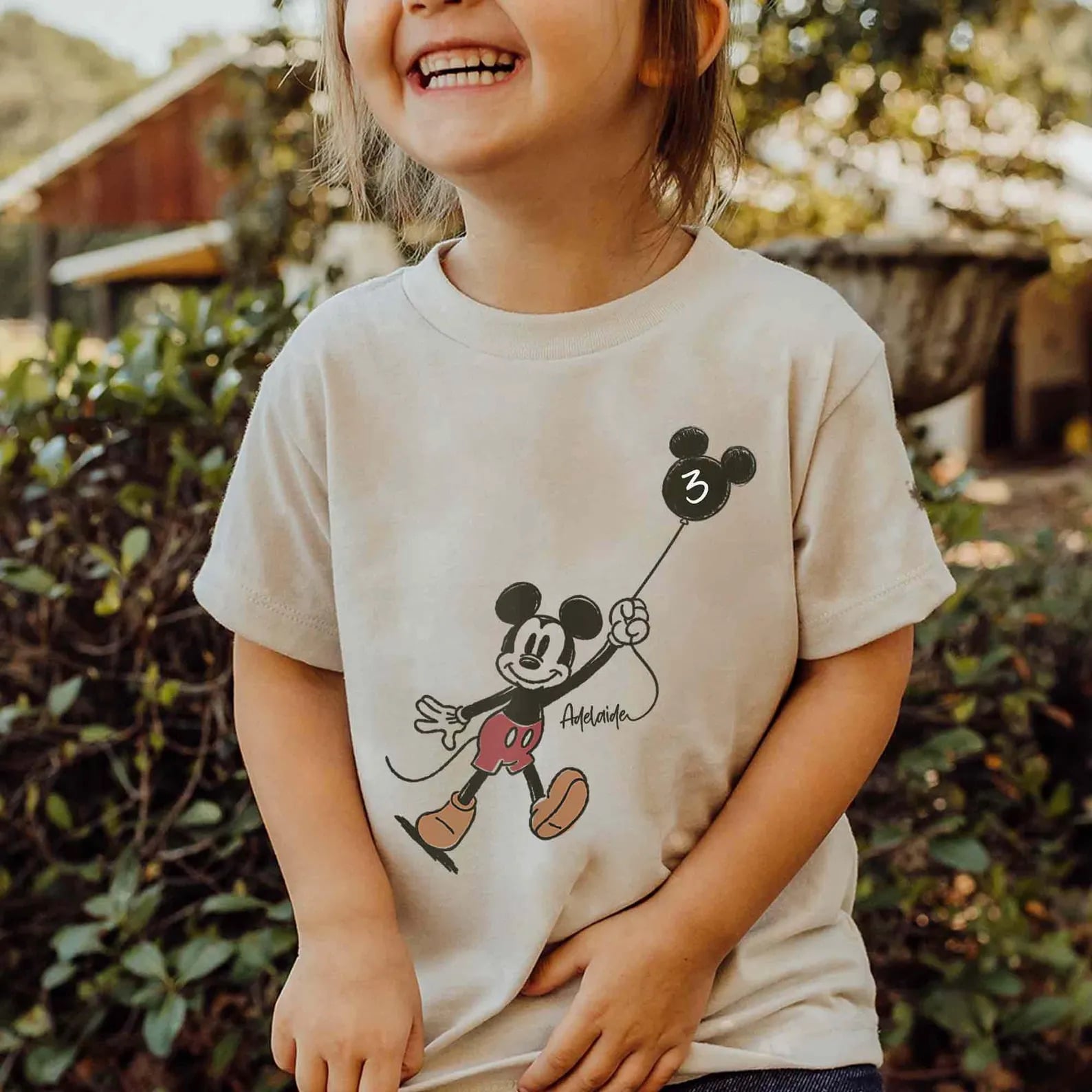 Custom kid t-shirt with Mickey Mouse holding a personalized age balloon