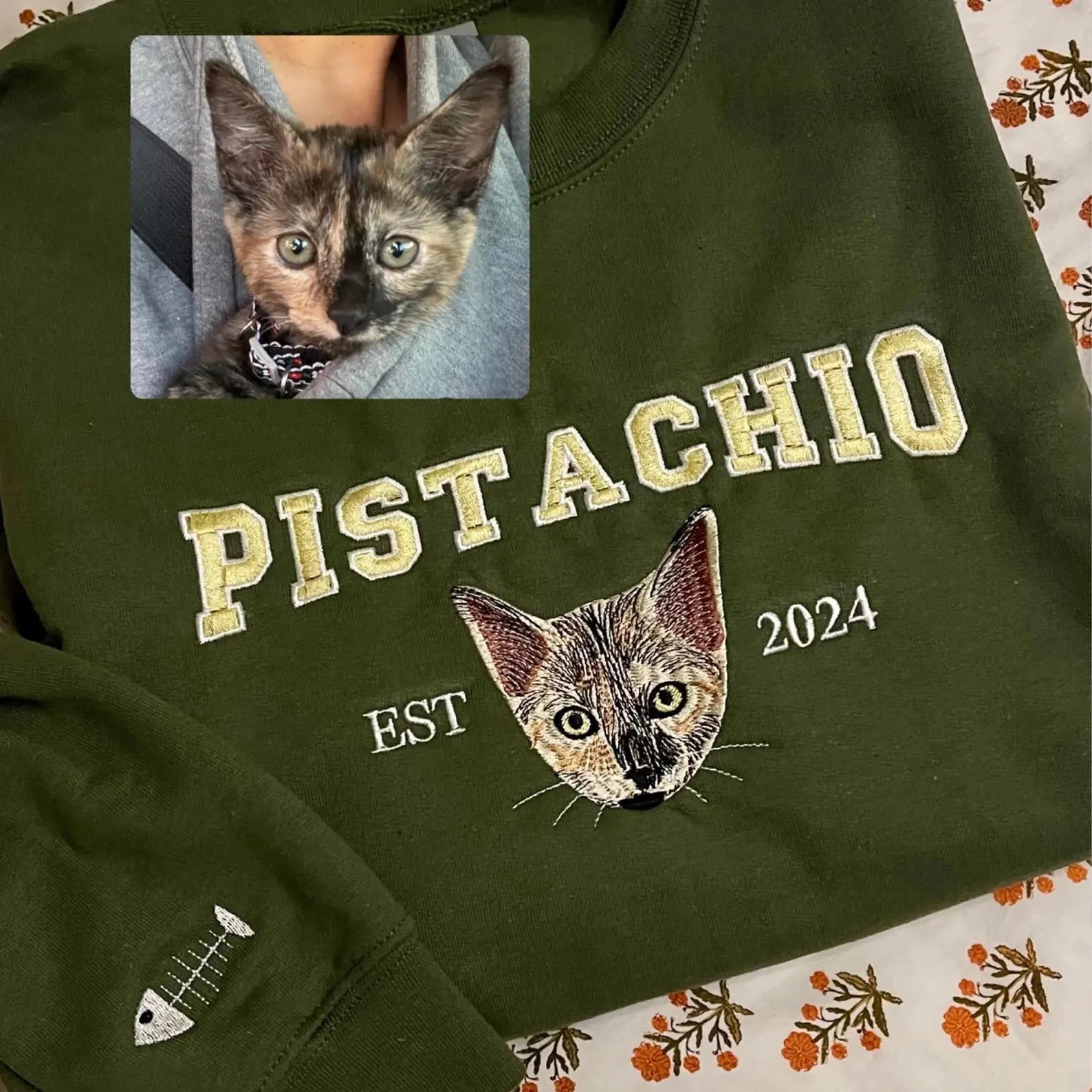 Green sweatshirt with custom embroidered cat portrait and name