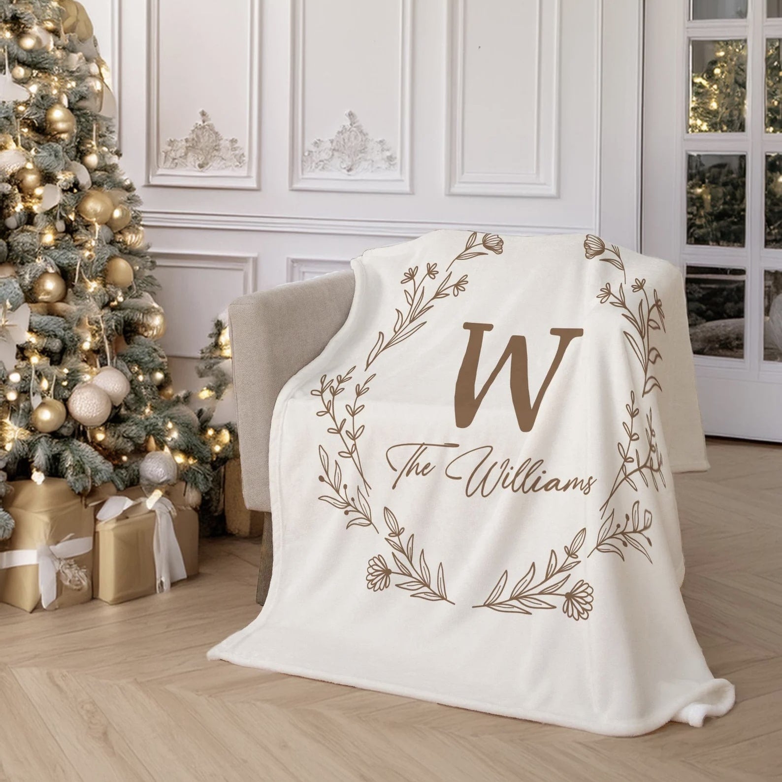 Custom family monogram blanket displayed on a cozy armchair