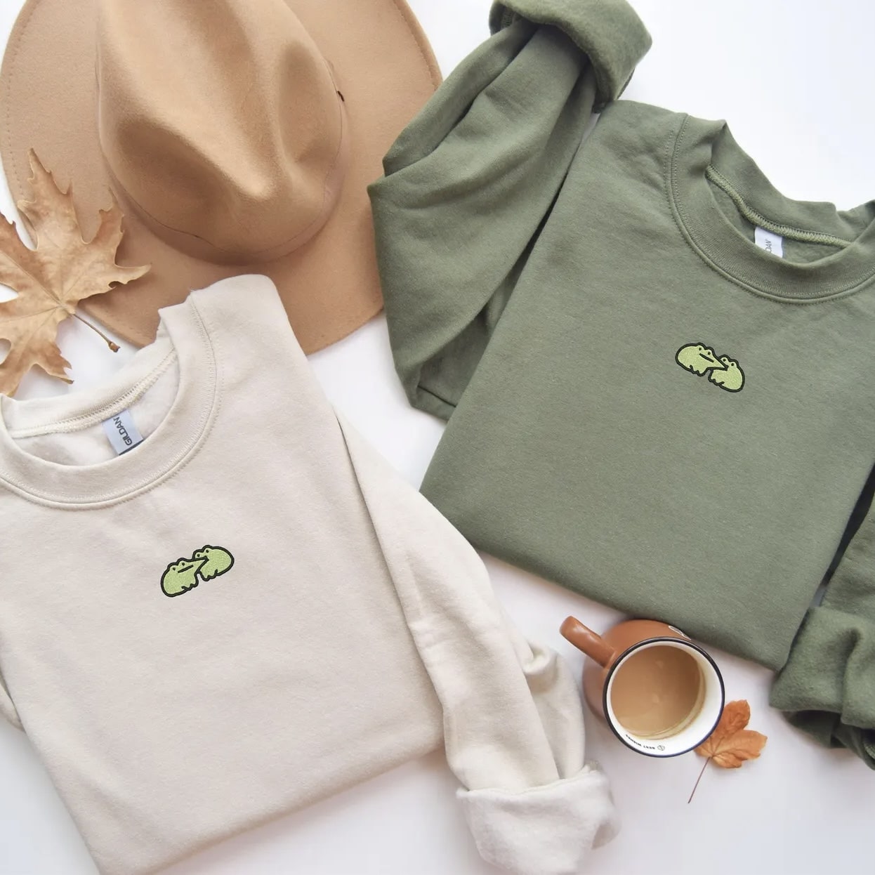 Unisex Frog Butt crewneck displayed with accessories