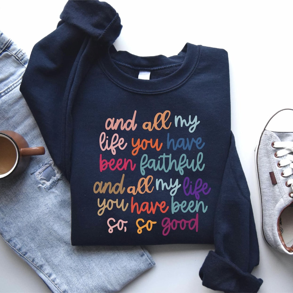 Navy sweatshirt with colorful "And all my life You have been faithful" graphic.