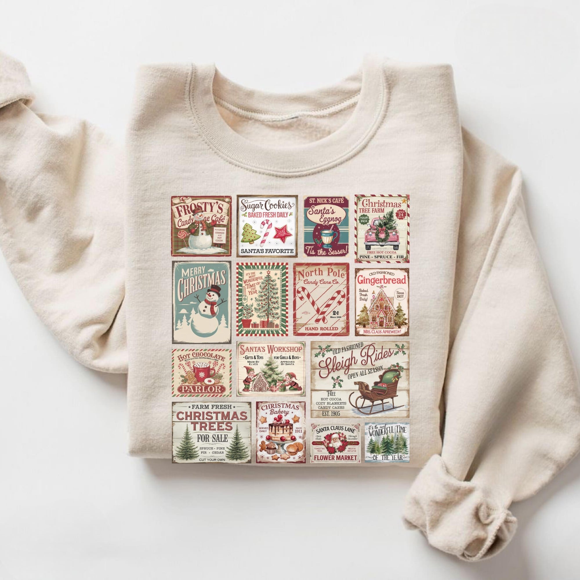 Cream vintage-style Christmas sweatshirt with colorful patchwork holiday designs featuring snowmen, trees, and candy canes.
