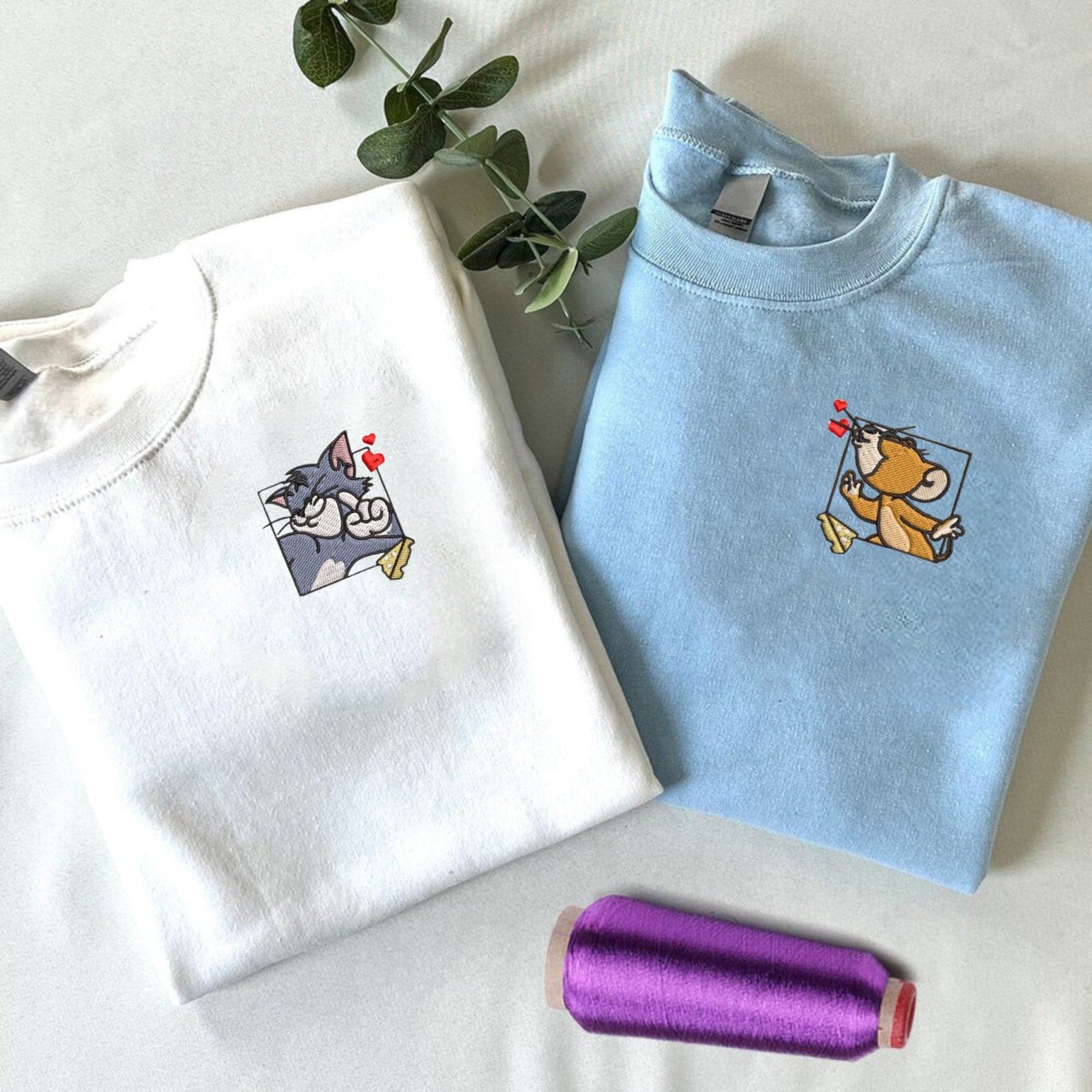 Tom and Jerry embroidered couple hoodies with love-themed design.

