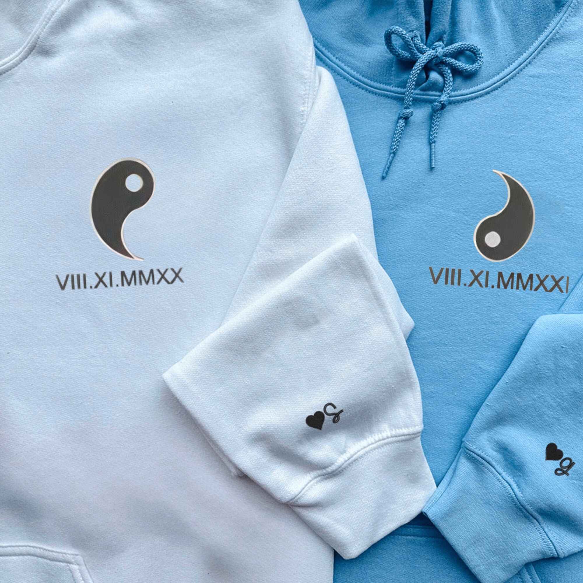 Matching custom hoodies featuring Yin & Yang symbols.
