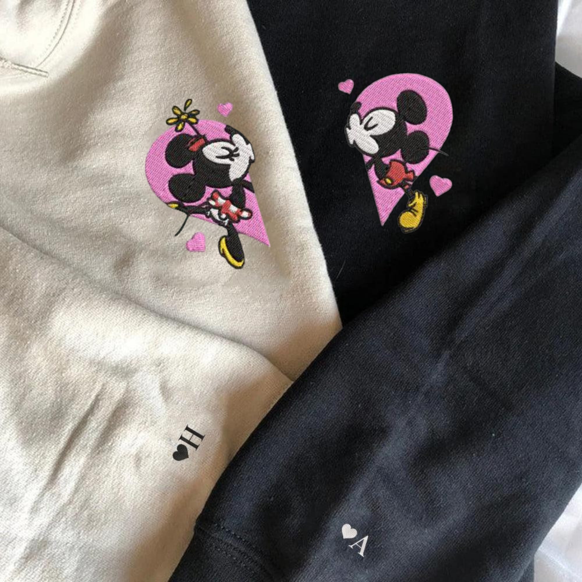 Disney-inspired Mickey and Minnie matching couple hoodies forming a heart.

