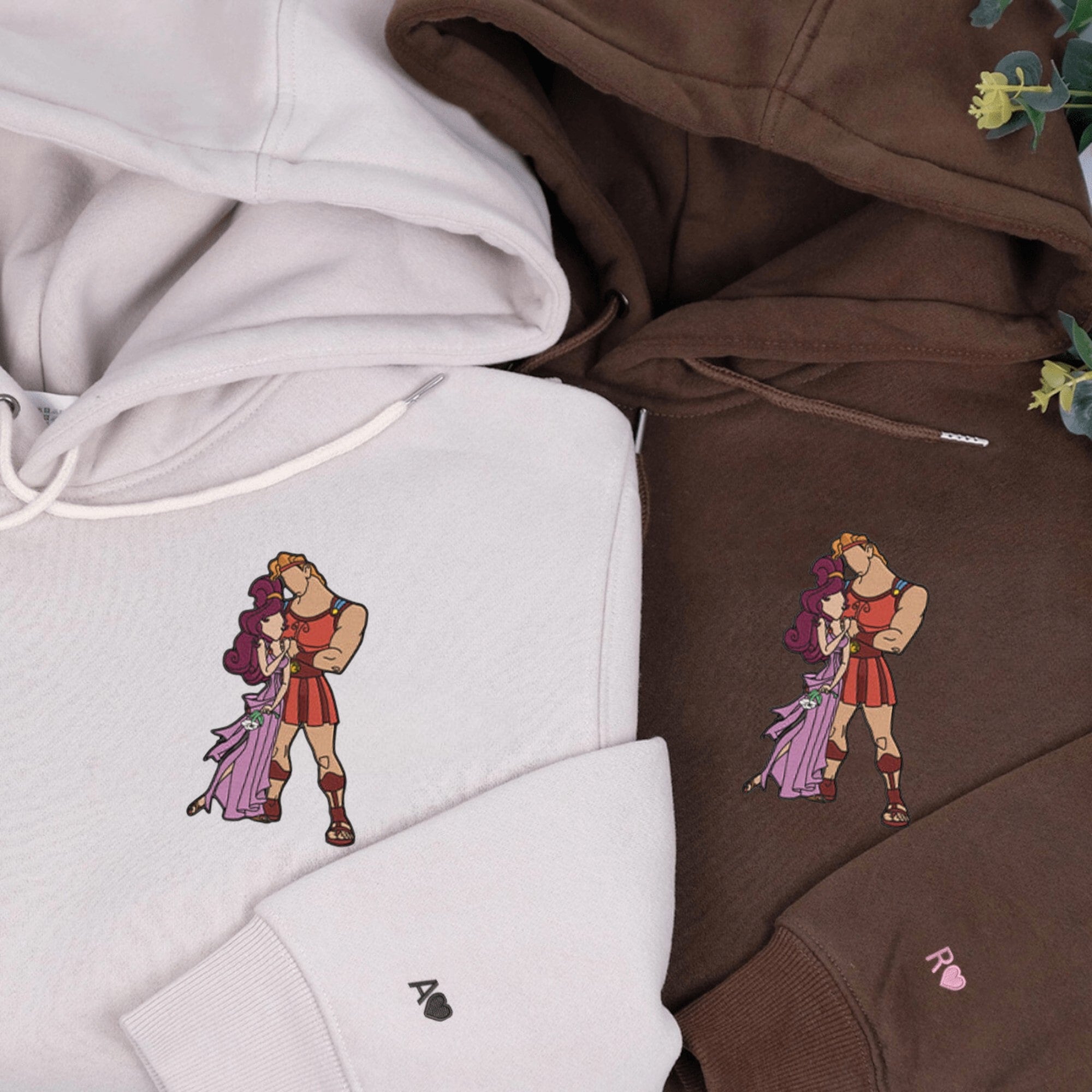 Matching couple hoodies with Hercules and Megara embroidered design.

