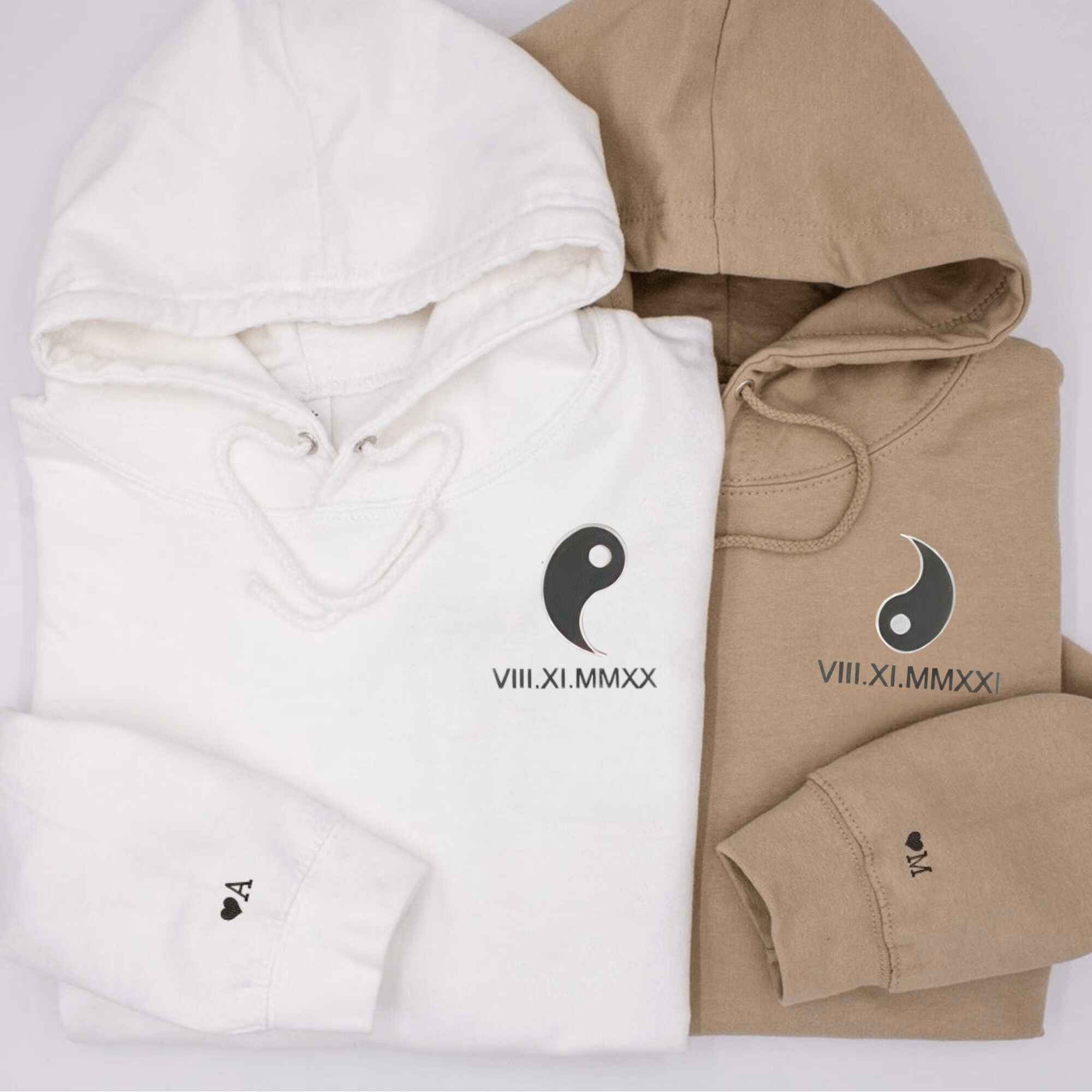 Yin & Yang embroidered couple hoodies for balance.
