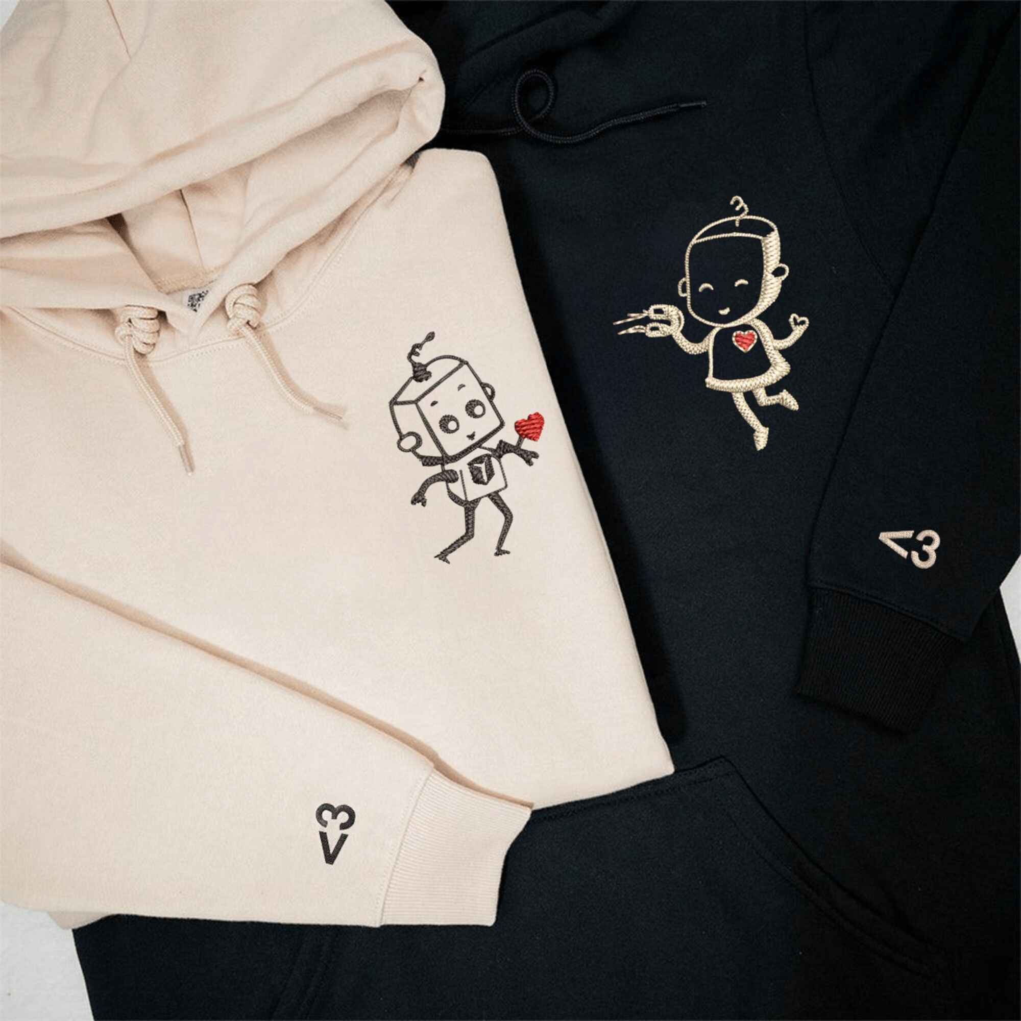 Matching Couple Hoodies featuring cute robot designs with personalized heart details.
