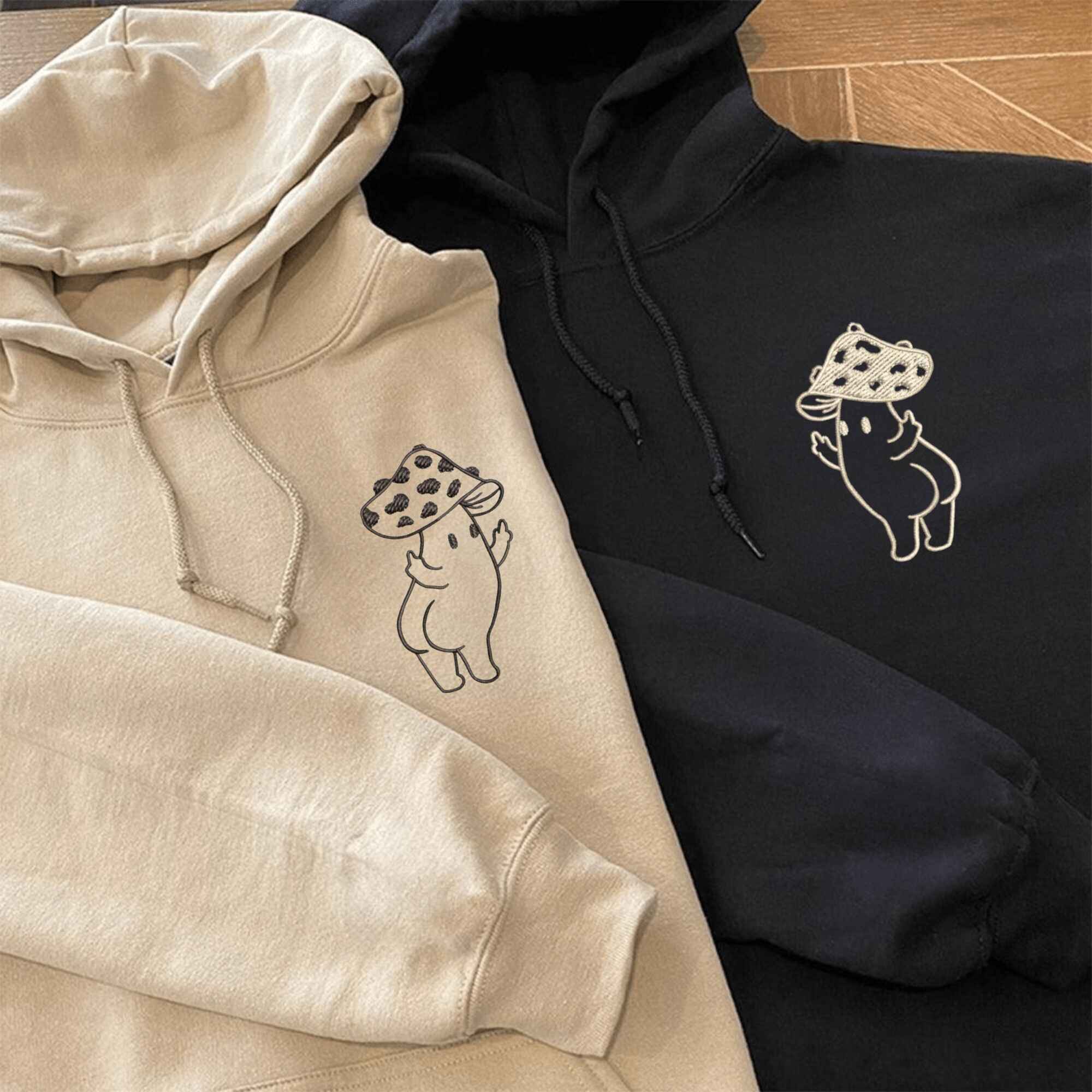 Matching couple hoodies featuring cheeky mushroom designs, perfect for couples.
