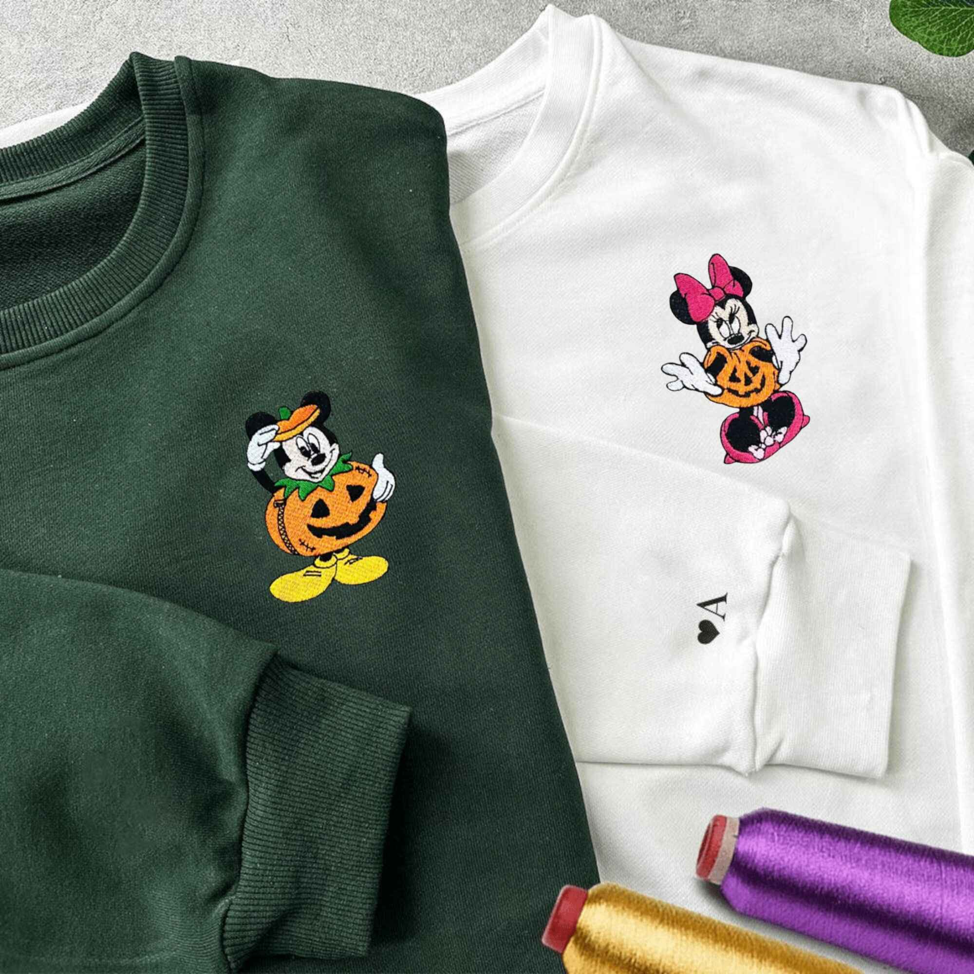 Custom embroidered Halloween Mickey and Minnie sweatshirts, perfect for Disney-loving couples.
