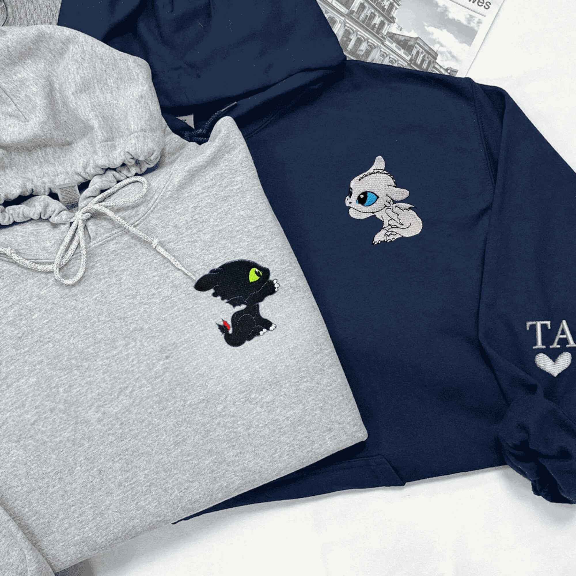 Custom hoodies with playful baby dragon designs, perfect for couples.
