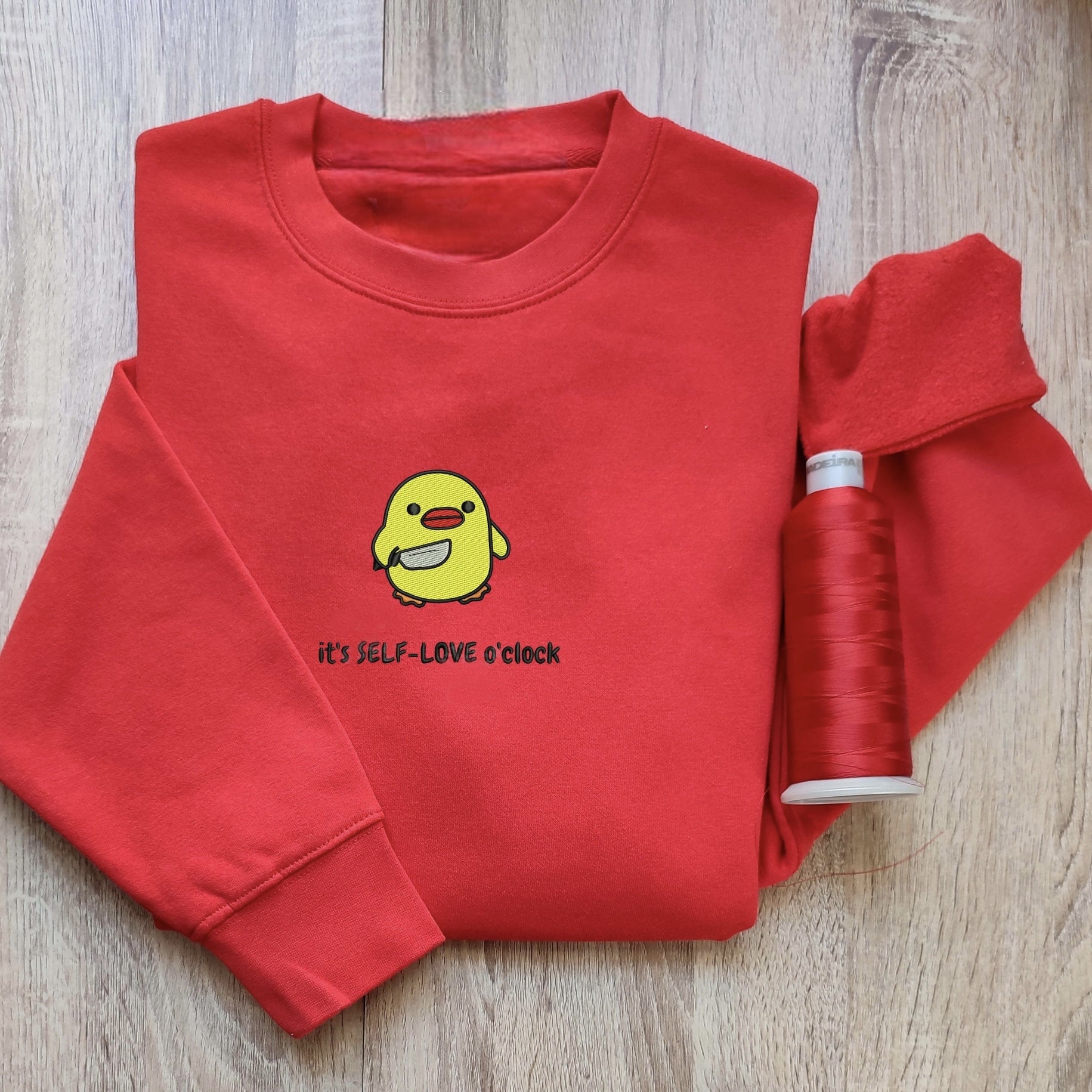 Custom embroidered graphic meme shirts with a motivational "Self-LOVE o'clock" duck design, capturing the essence of a t-shirt meme.
