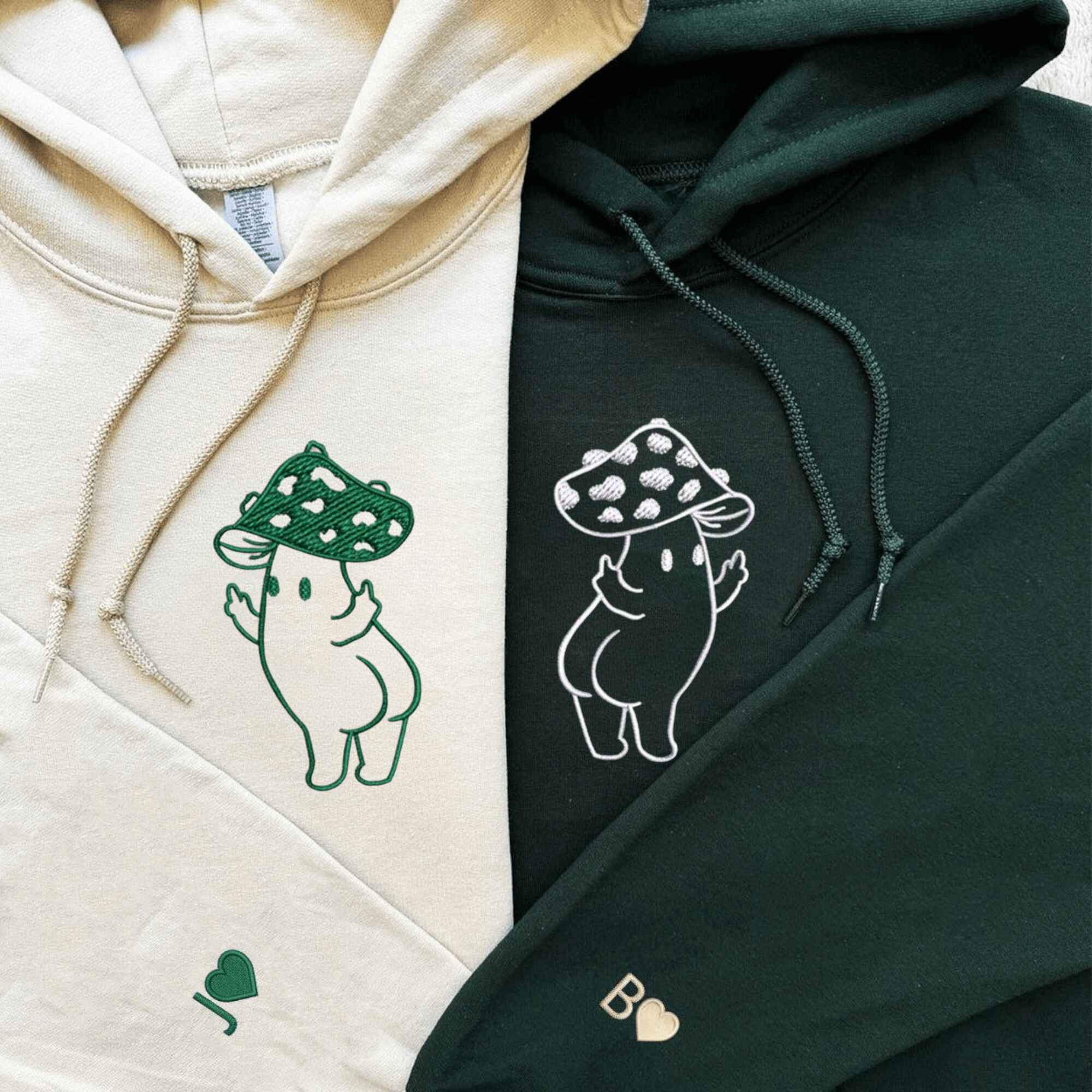 Custom embroidered mushroom couple hoodies with playful middle finger design.
