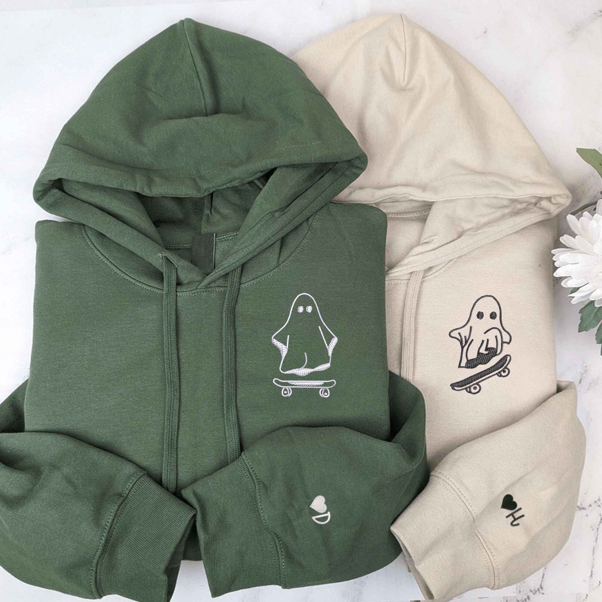 Custom embroidered skating ghost couple hoodies, perfect for fun-loving couples.
