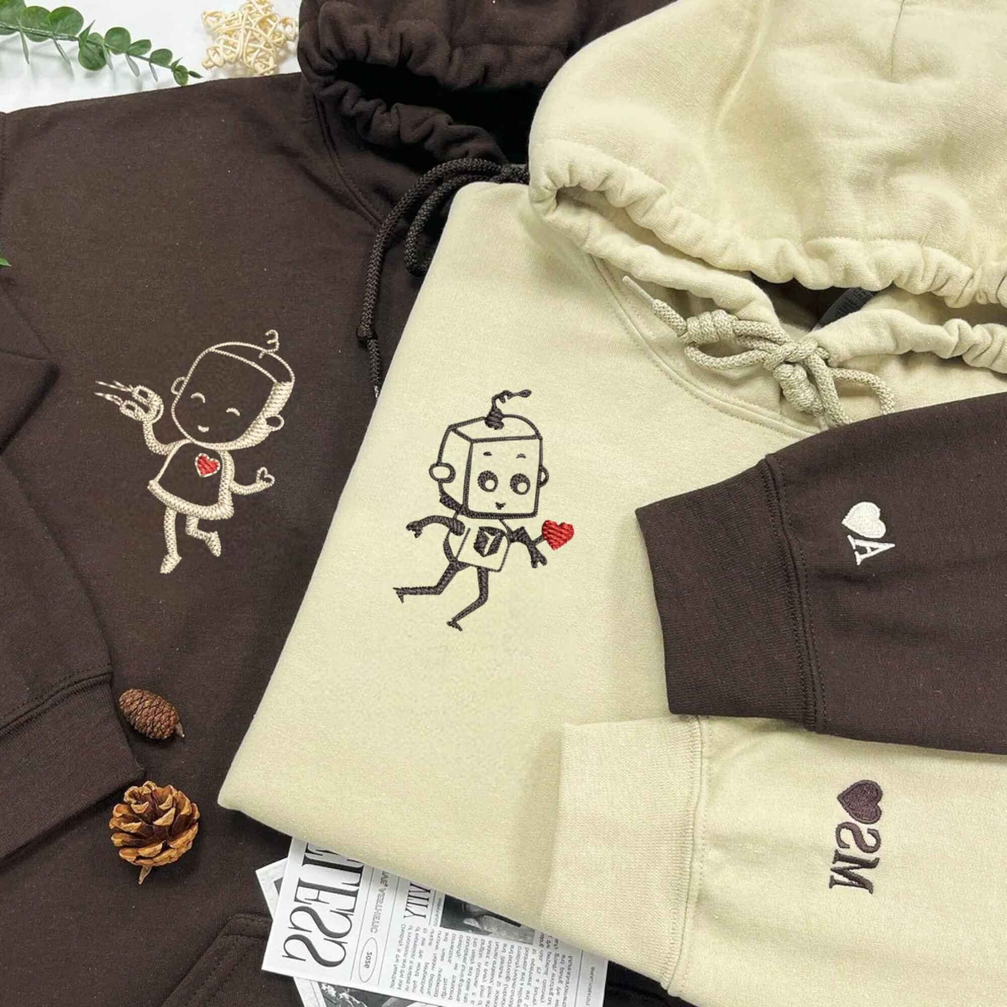 Matching Couple Hoodies with custom embroidered matching couple sweatshirts showcasing adorable robot motifs.
