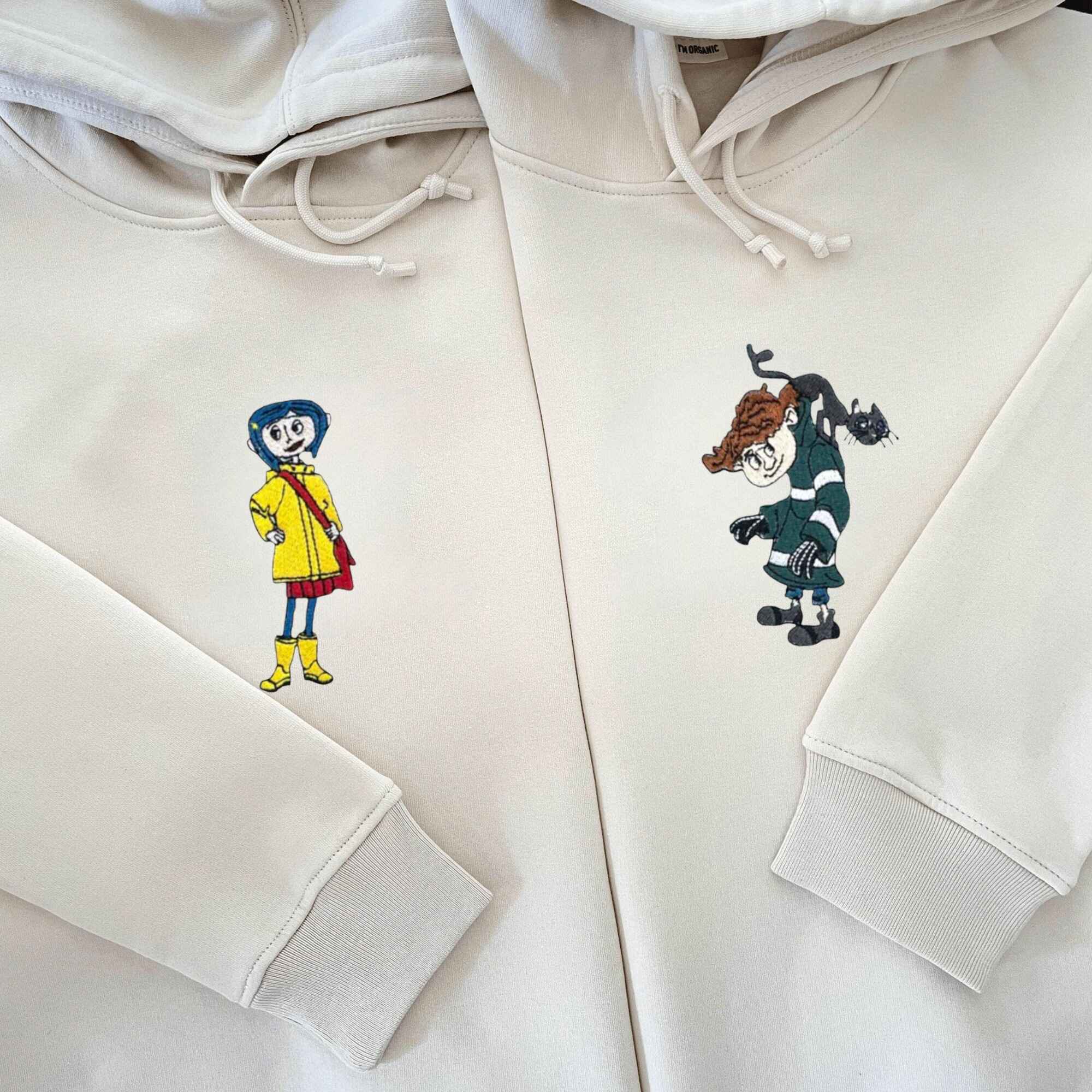 Matching Couple Hoodies featuring Coraline and Wybie designs with personalized details.
