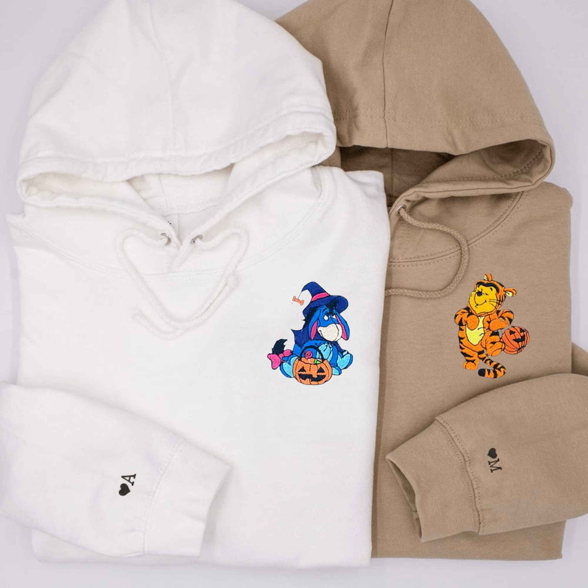 Custom embroidered Eeyore and Tigger Halloween couple hoodies, perfect for Disney lovers.
