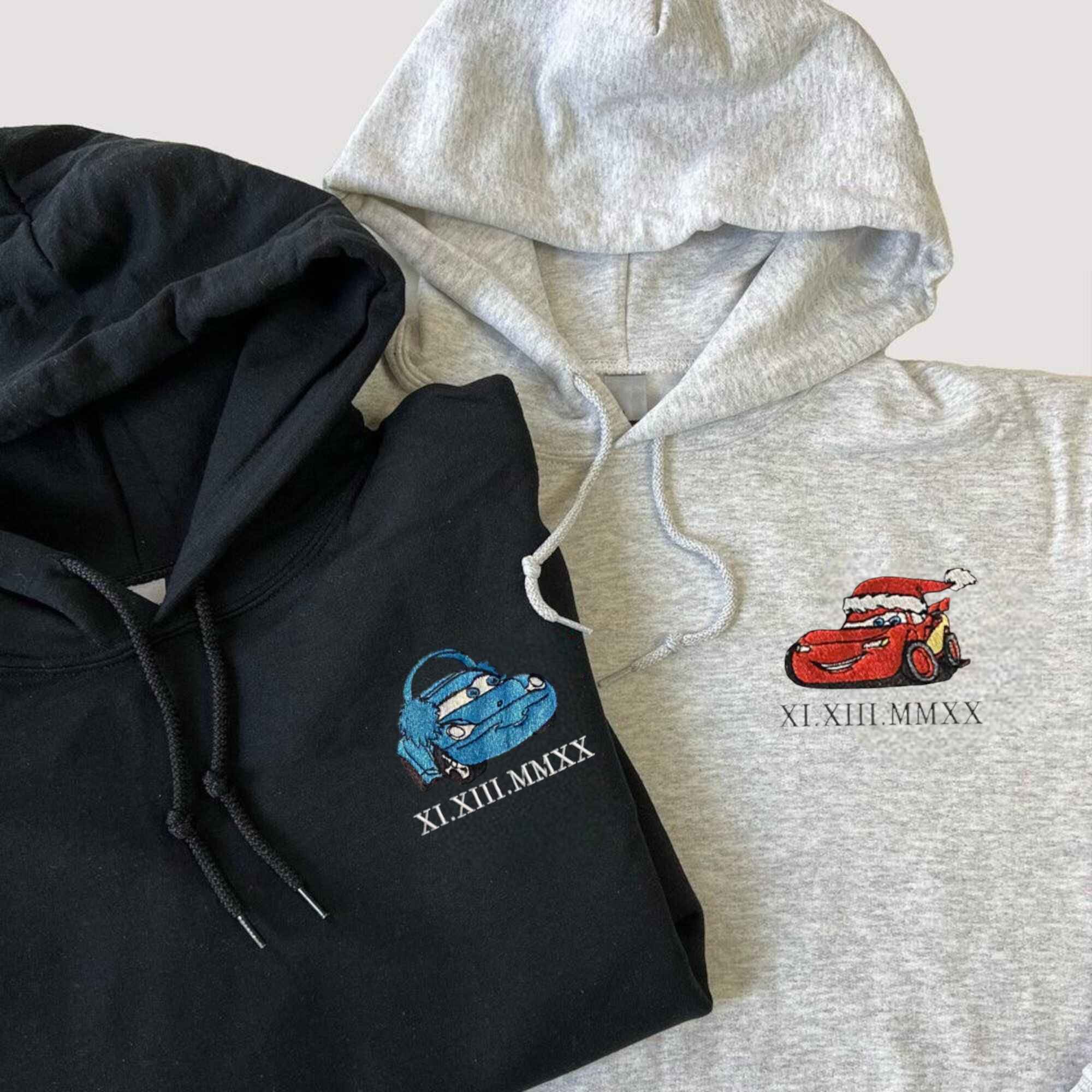 Matching couple hoodies with custom embroidered car designs, ideal anniversary gifts.
