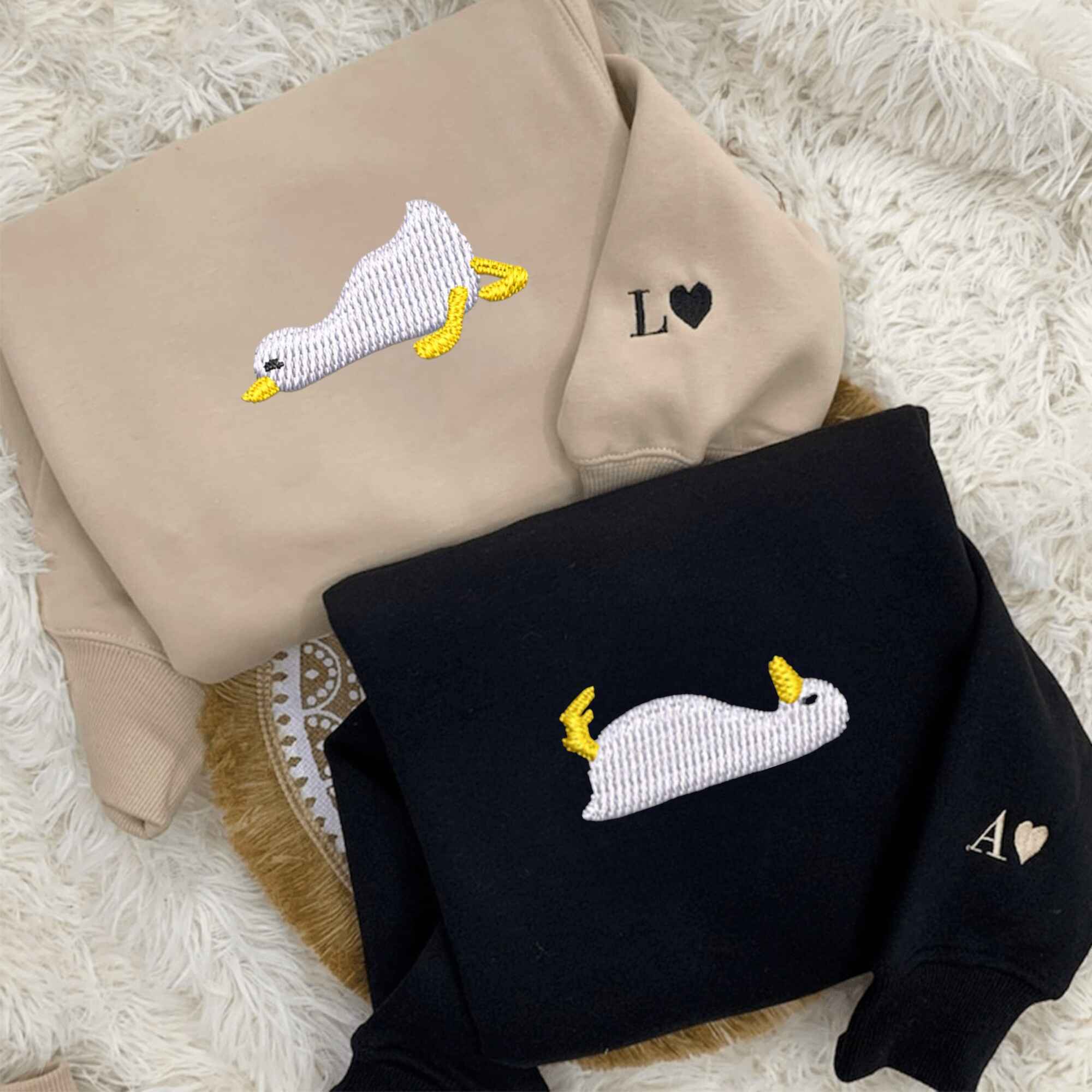 Cozy couple hoodies with an adorable embroidered duck detail.
