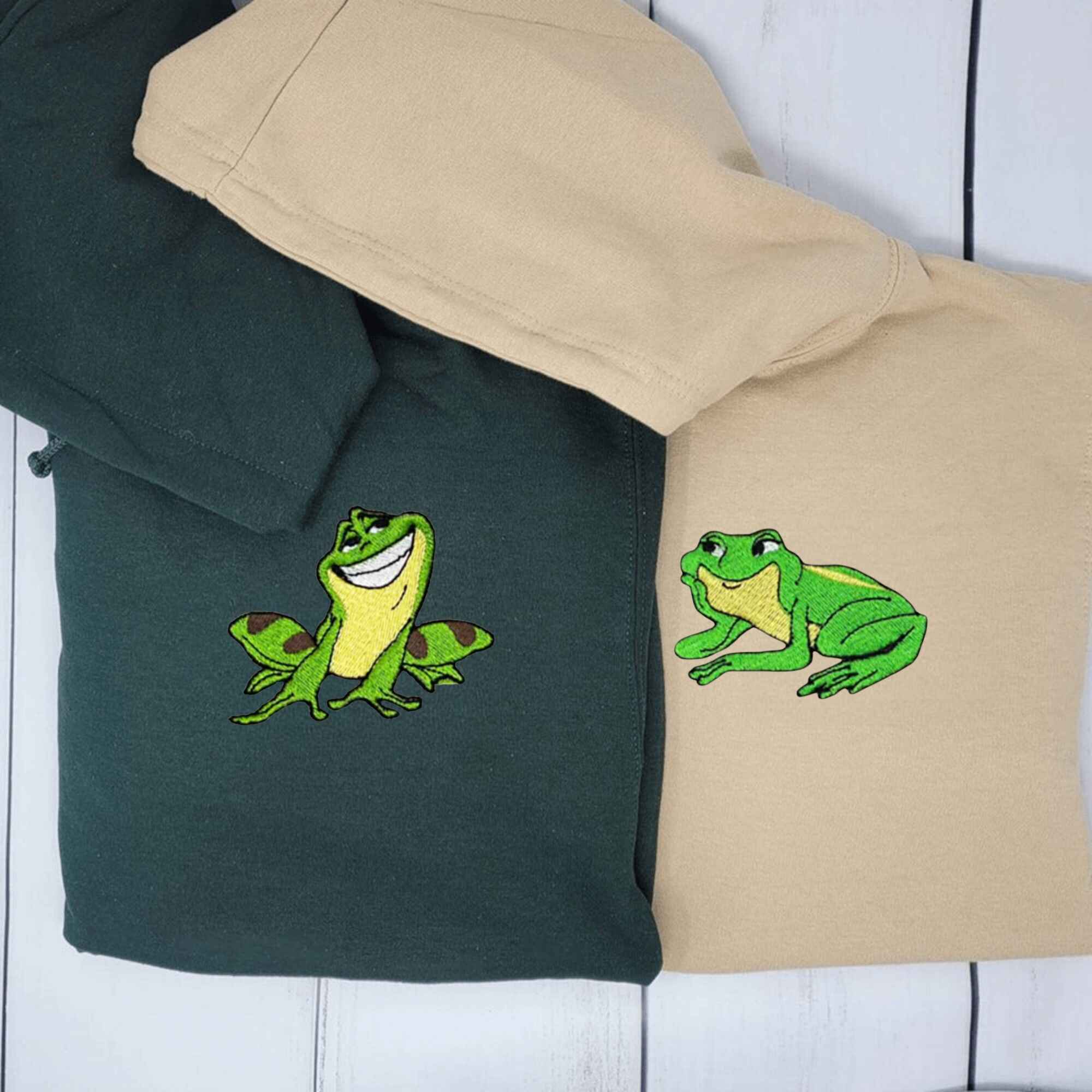 Frog Prince couple hoodies featuring embroidered frog designs.
