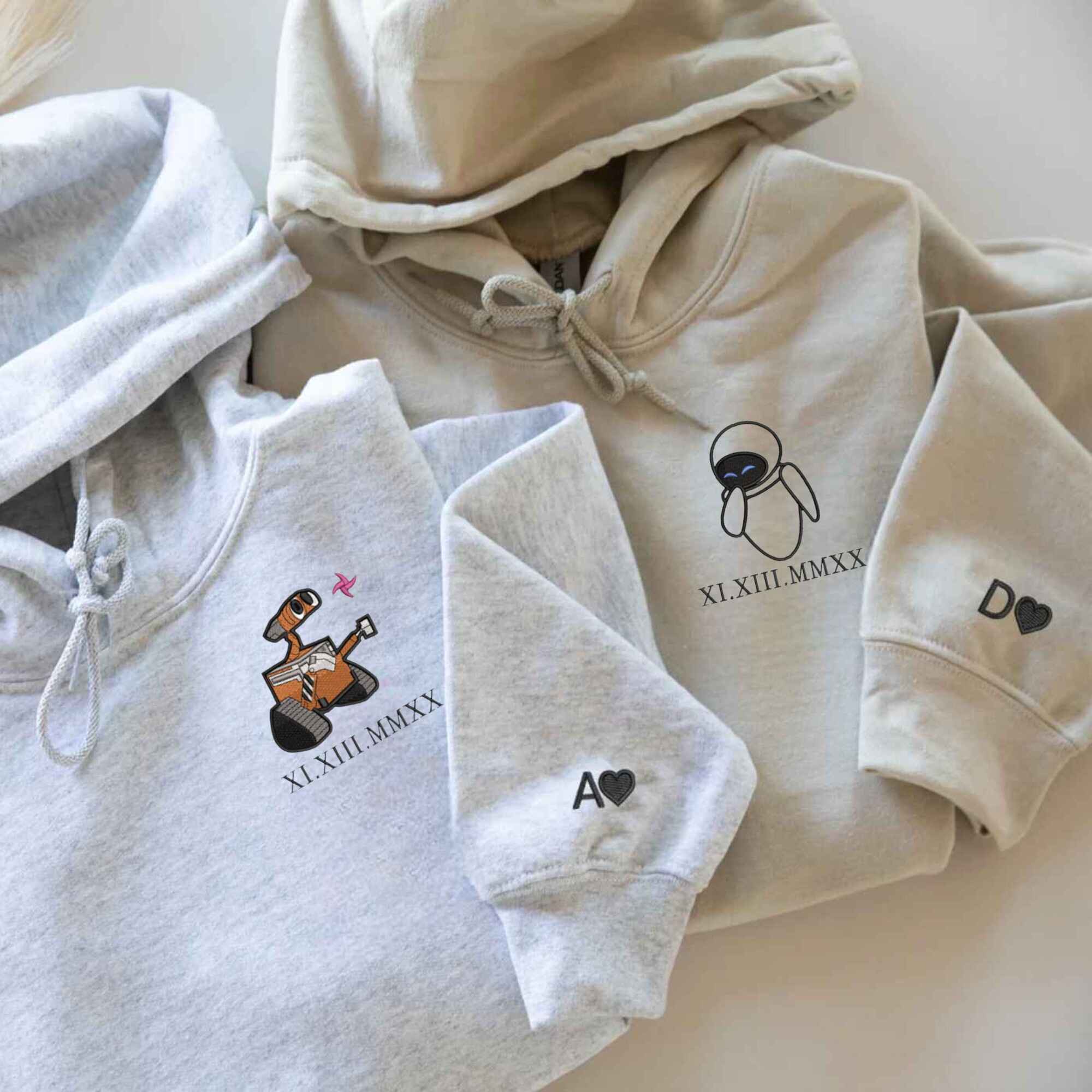 Adorable Wall-E and Eve embroidered sweatshirts, great anniversary gifts.
