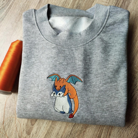 Custom embroidered graphic meme shirts featuring two hugging creatures, ideal for best gag gifts for men.
