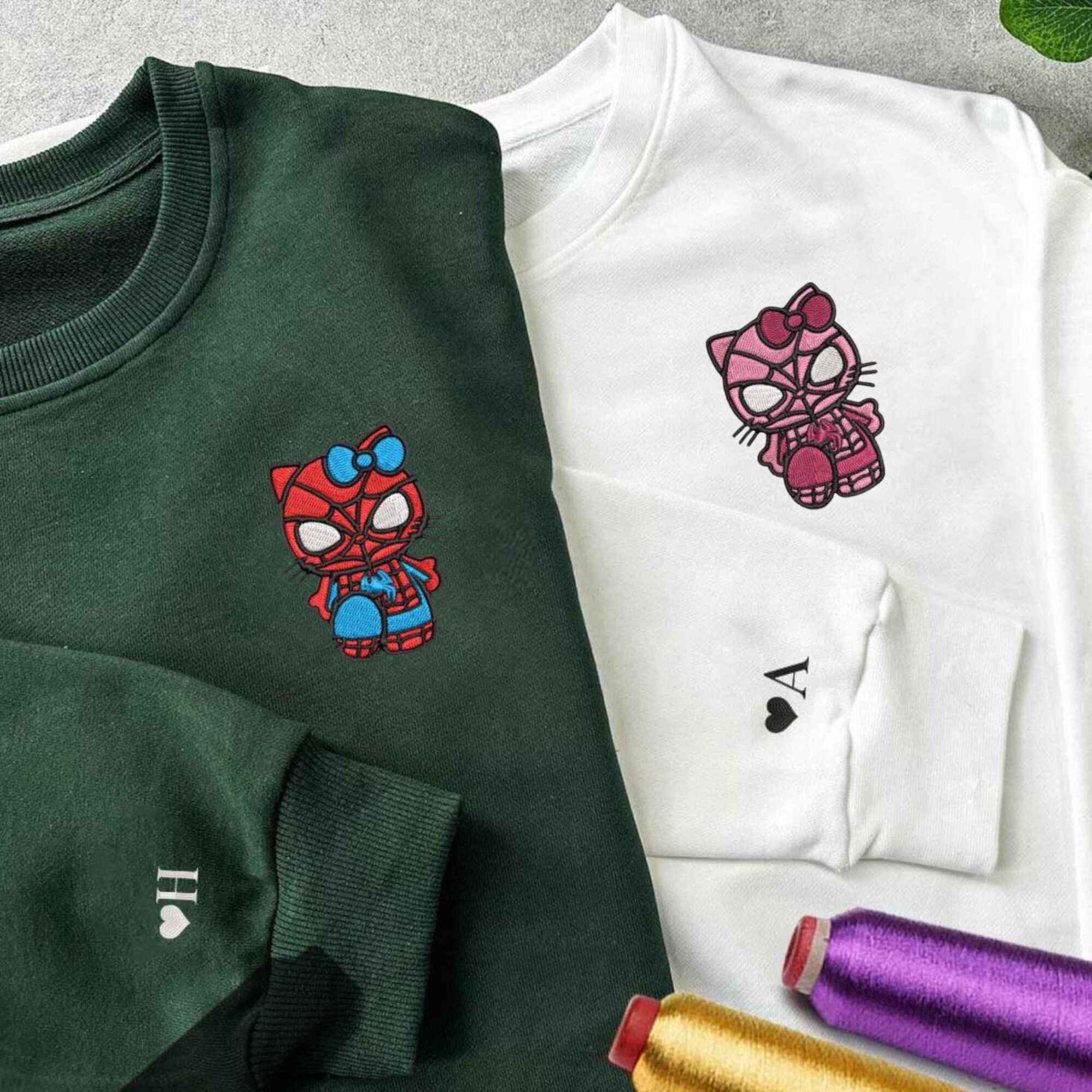 Matching Couple Hoodies with custom embroidered matching couple sweatshirts showcasing a cute superhero cat motif.
