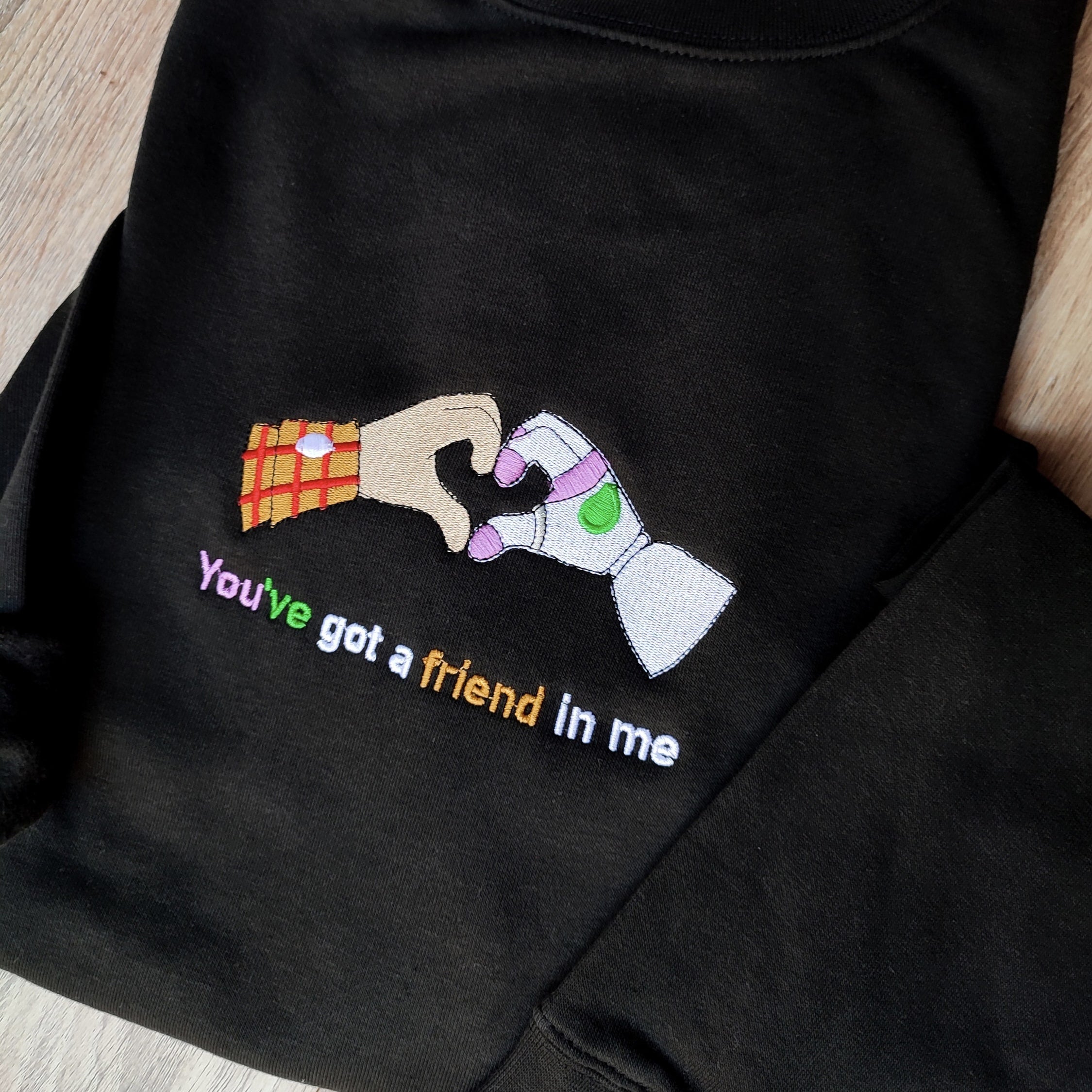 Custom embroidered graphic meme shirts featuring a "You've got a friend in me" design, ideal for best gag gifts for men.
