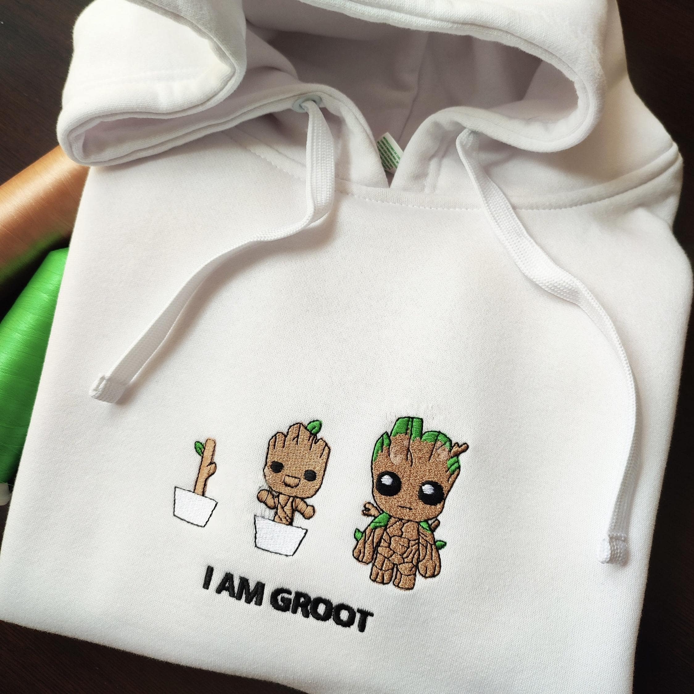 Custom embroidered graphic meme shirts highlighting a fun "I AM GROOT" design, capturing the essence of a t-shirt meme.
