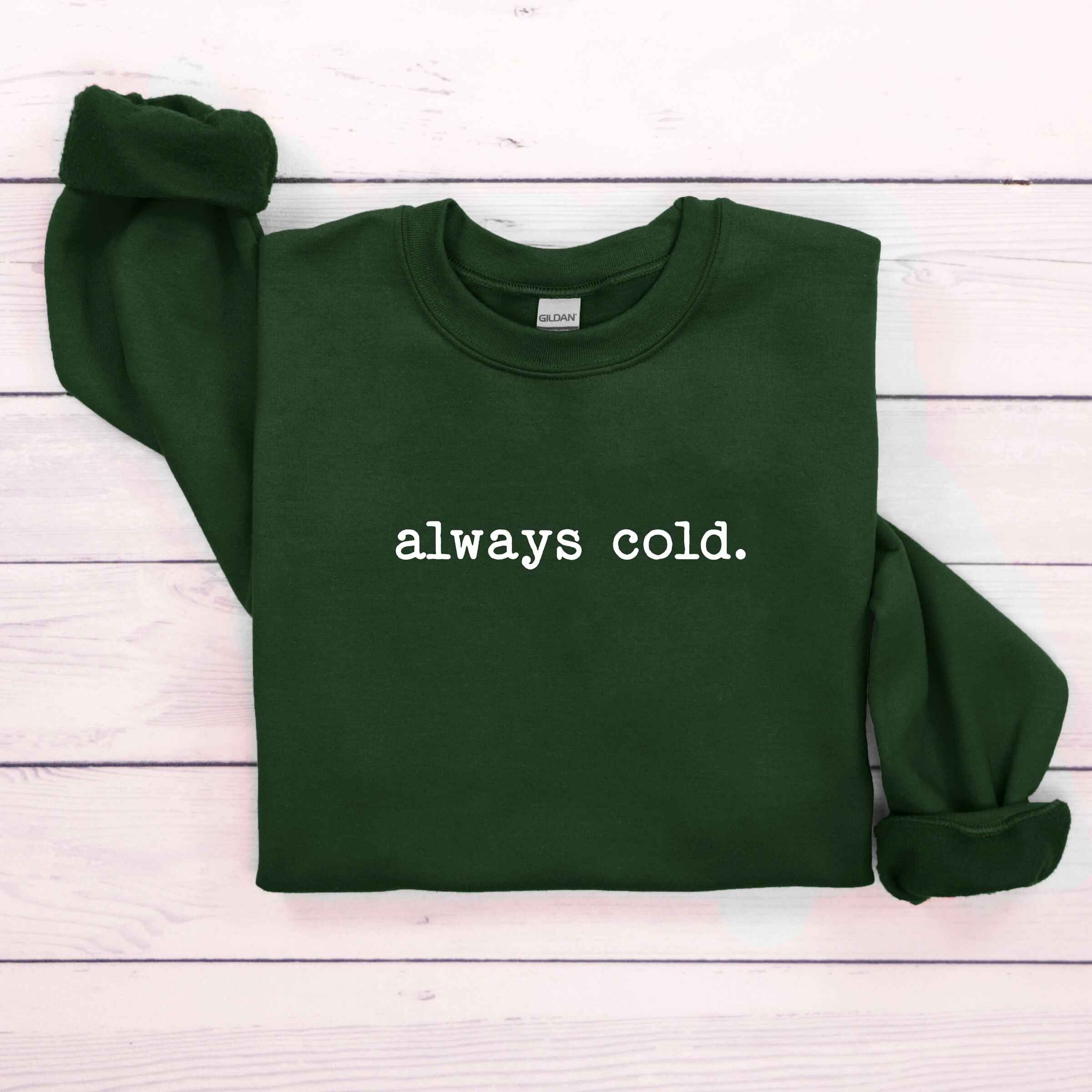 Customizable sweatshirt featuring "Always Cold" design
