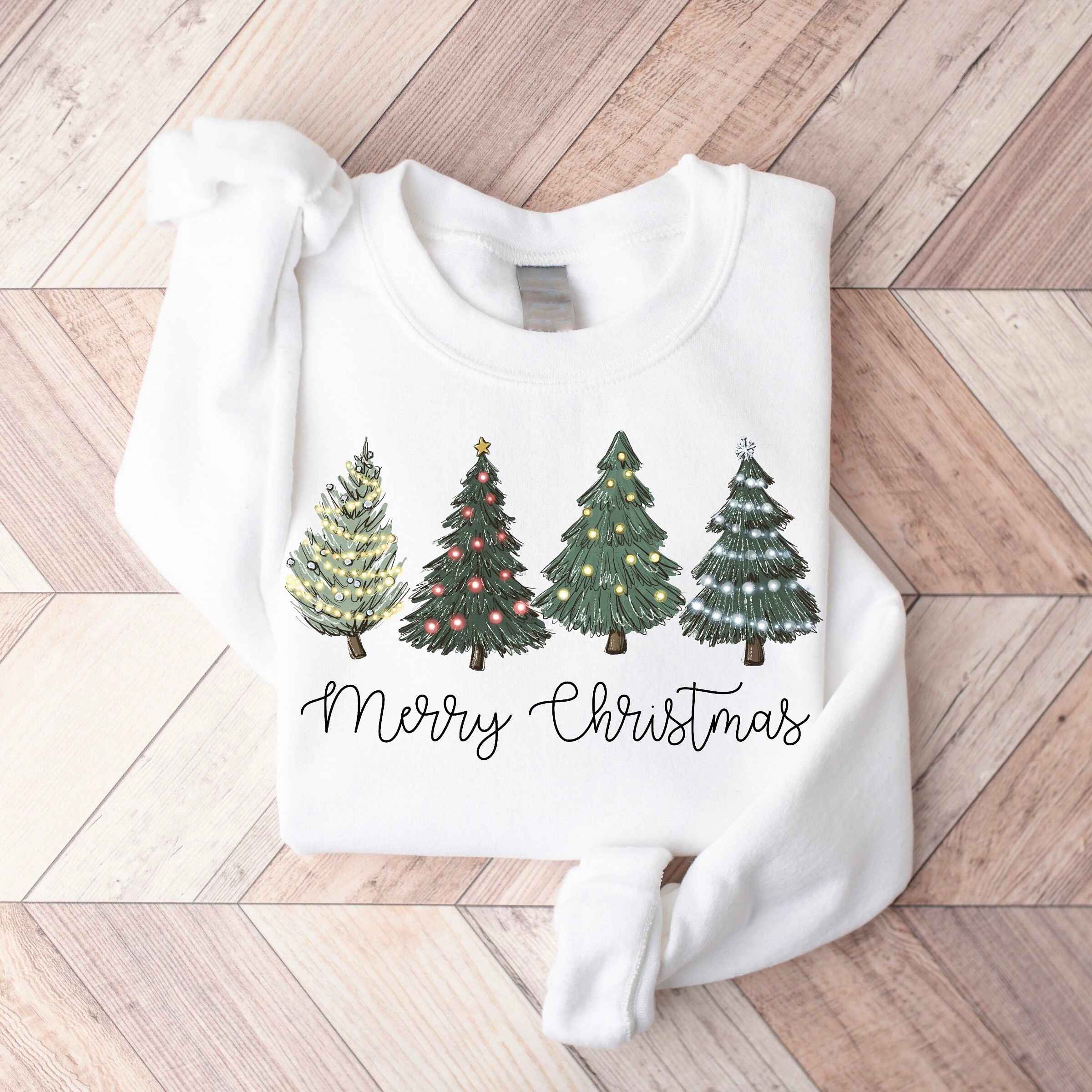 Festive Christmas sweatshirt featuring illuminated trees, various colors available
