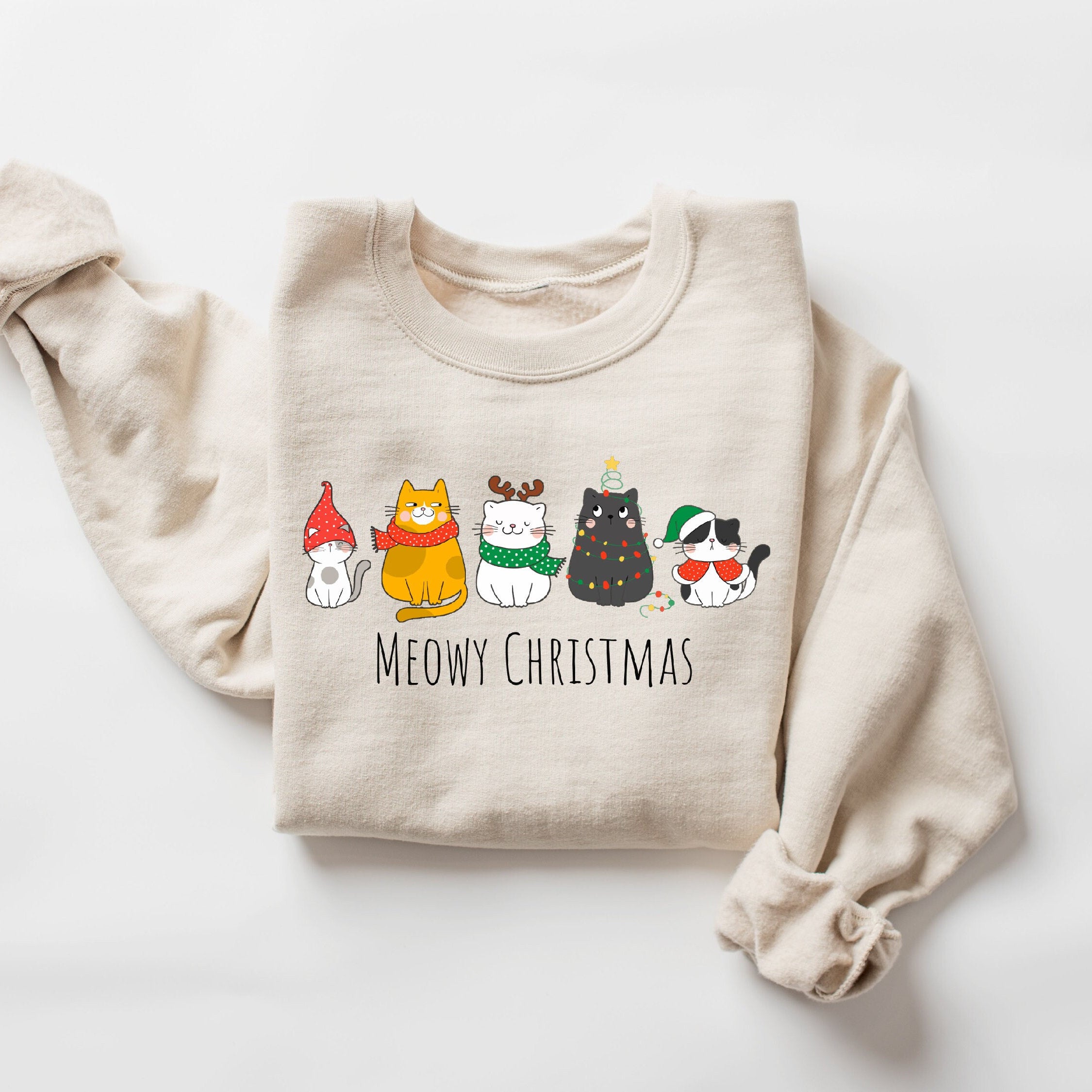 "Meowy Christmas" cat sweatshirt with festive holiday design
