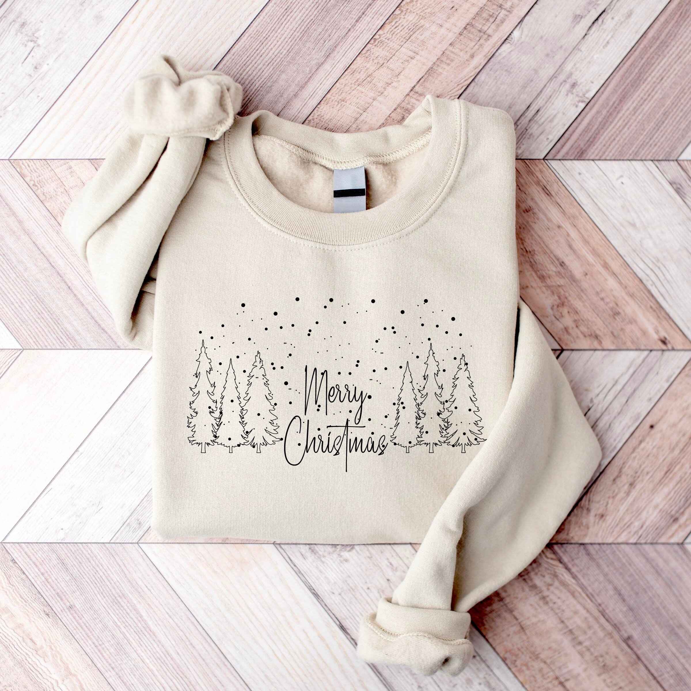 Cozy Christmas sweatshirt featuring festive forest scene
