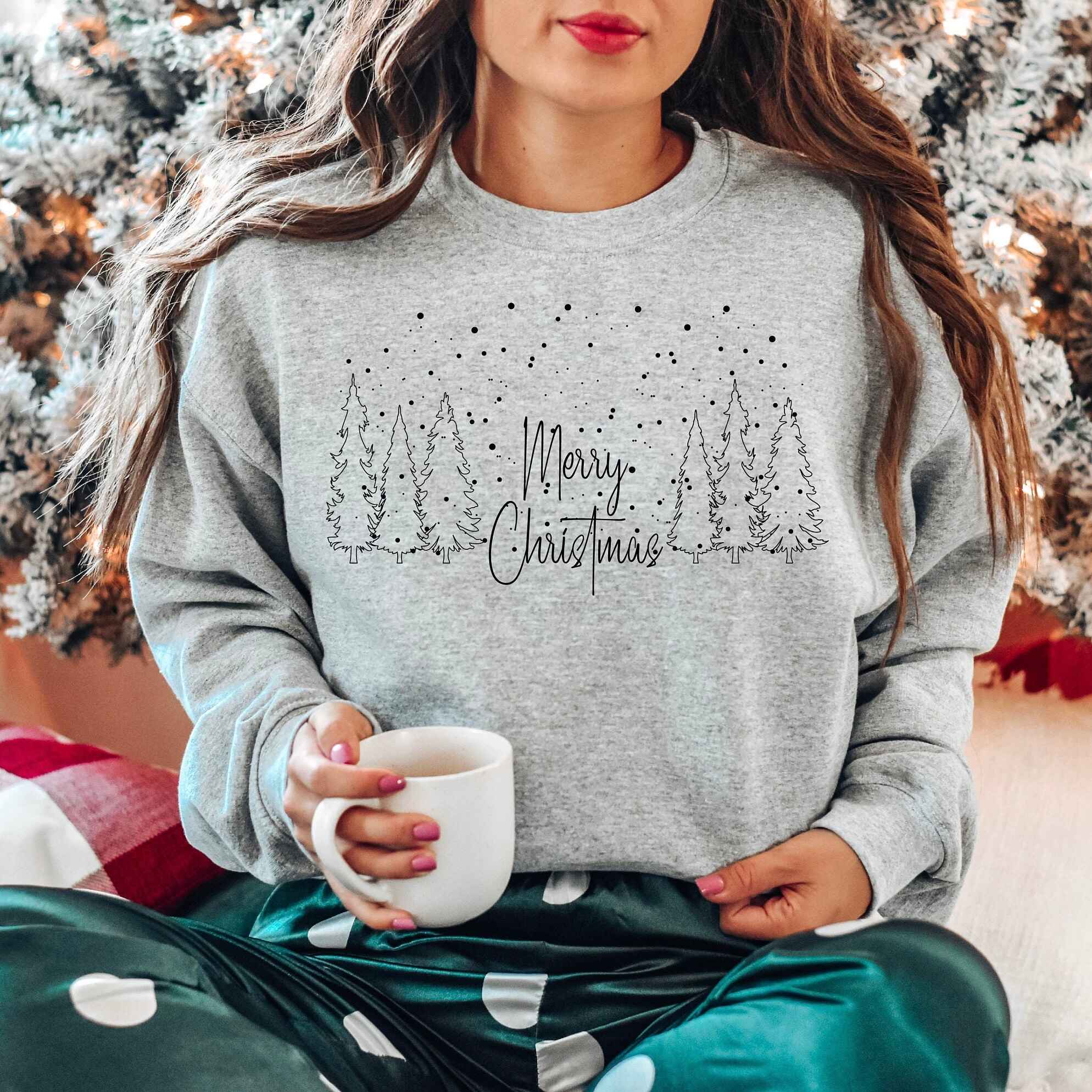 Burgundy "Merry Christmas" sweatshirt with forest and snow design
