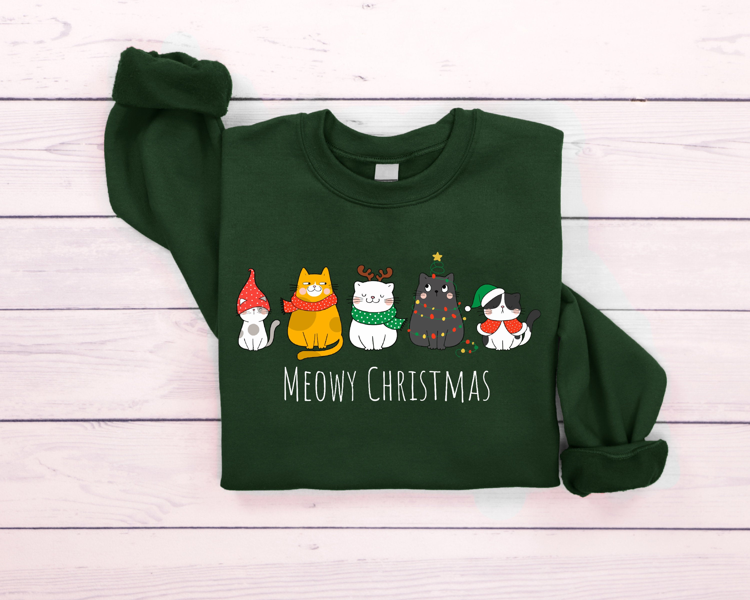 "Meowy Christmas" cat sweatshirt with festive holiday design
