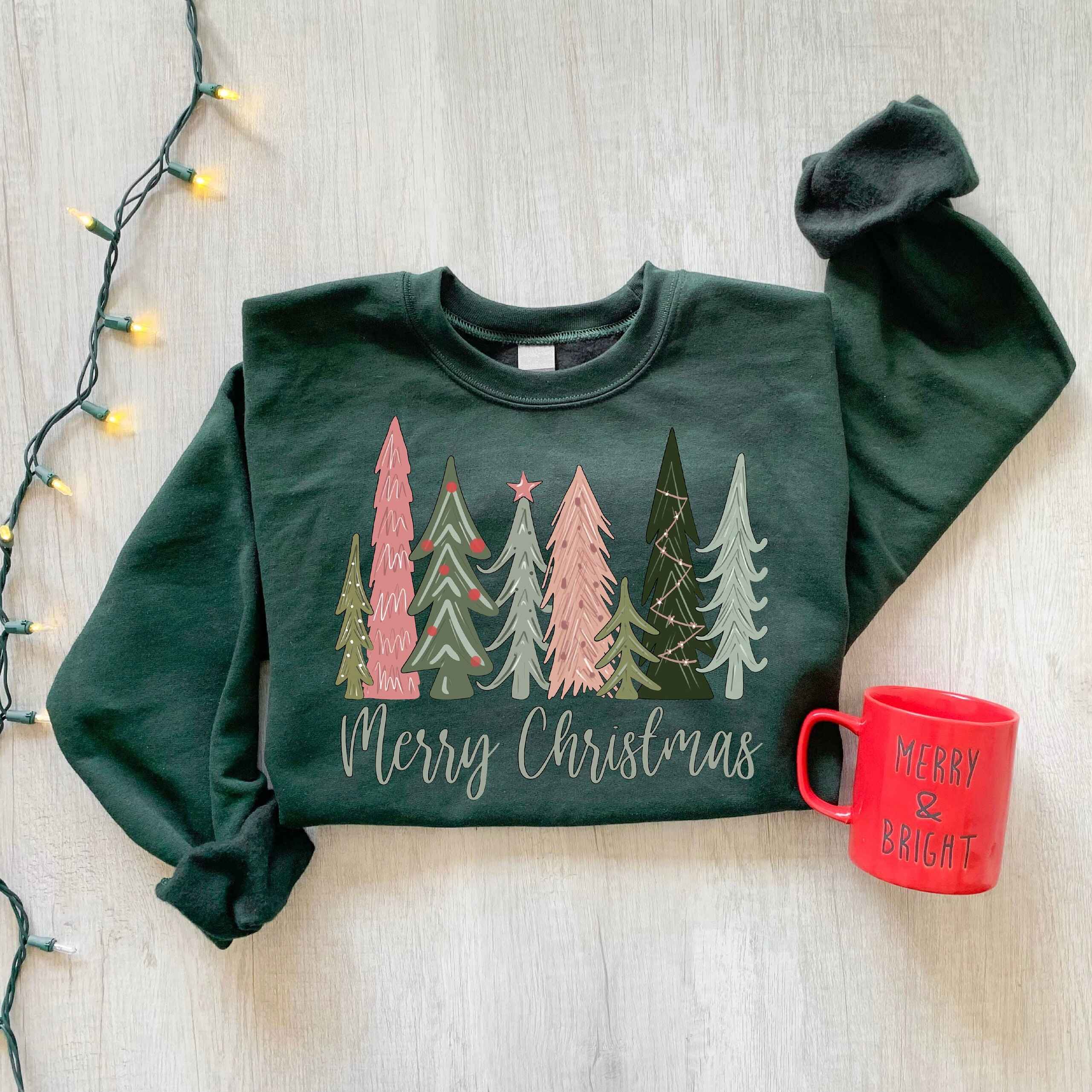 Cozy Christmas sweatshirt featuring colorful forest scene
