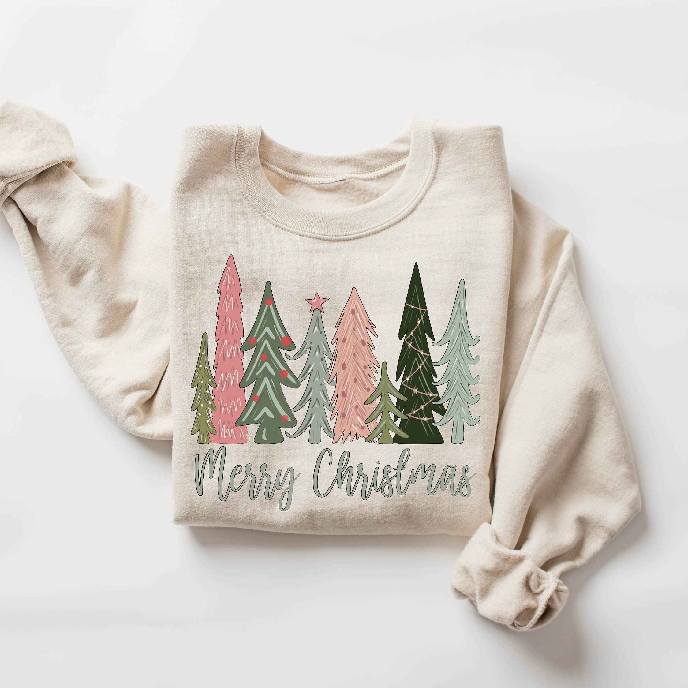 Green "Merry Christmas" sweatshirt with pastel holiday tree design
