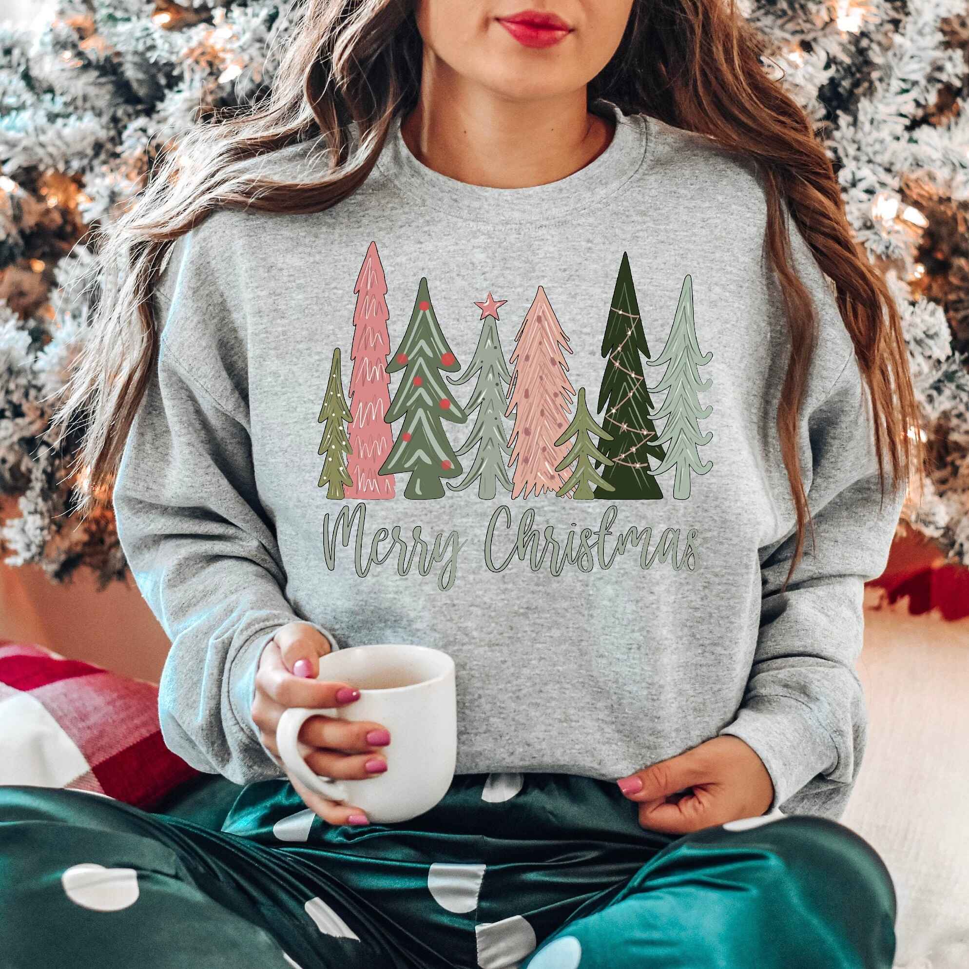 Cozy Christmas sweatshirt featuring colorful forest scene
