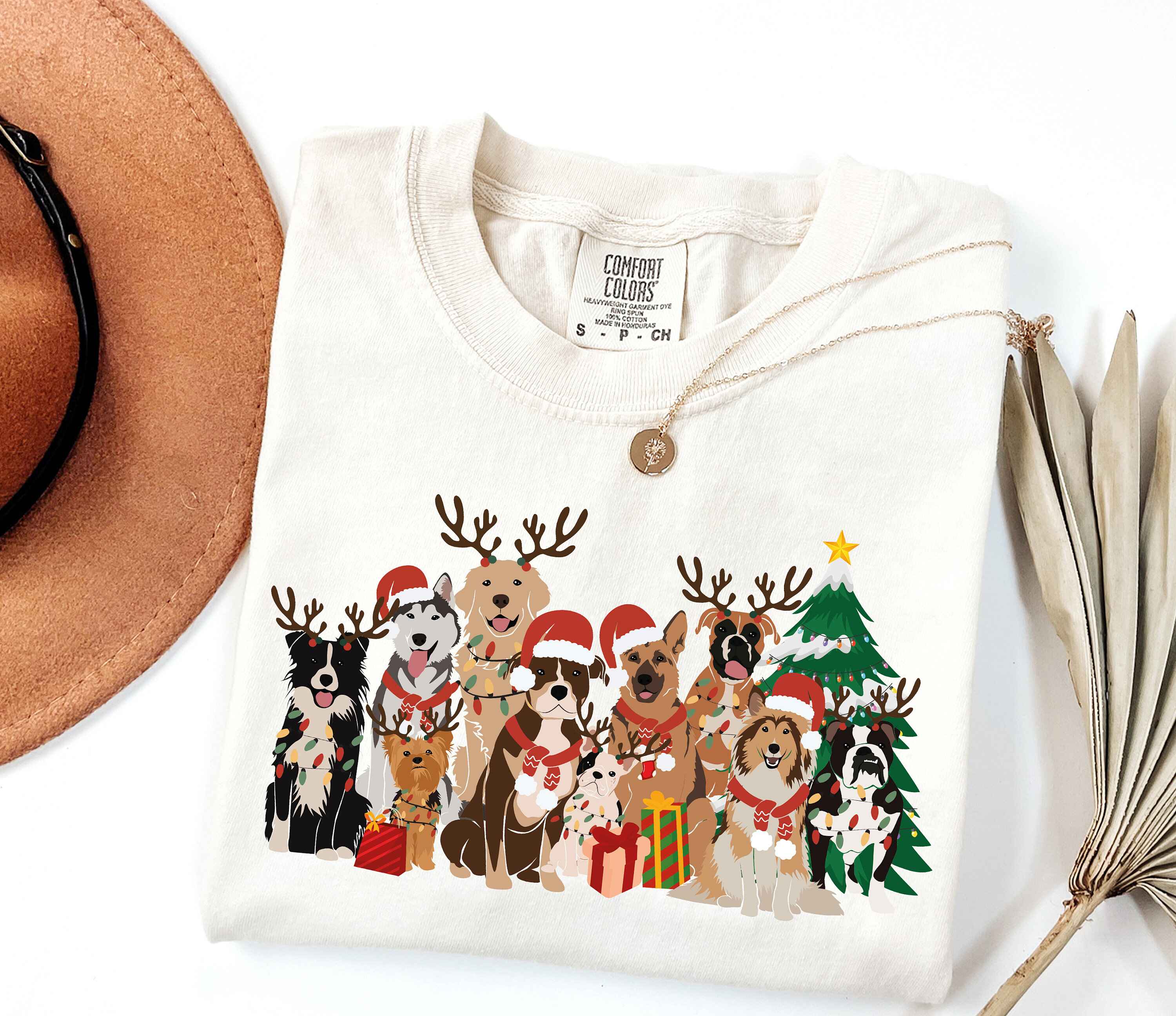 Holiday t-shirt featuring dogs with Santa hats and reindeer antlers
