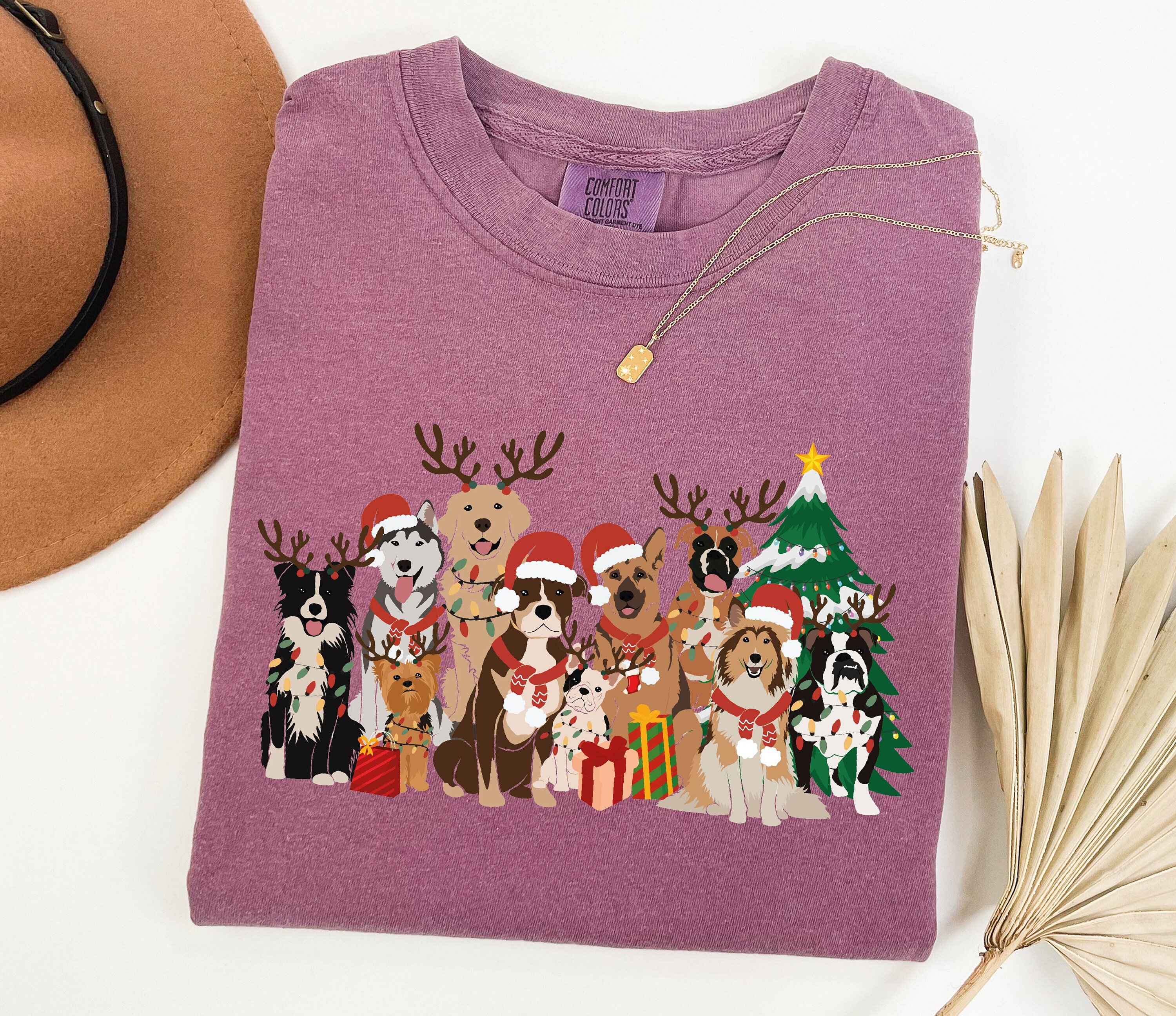 Christmas tee with festive dogs in holiday attire
