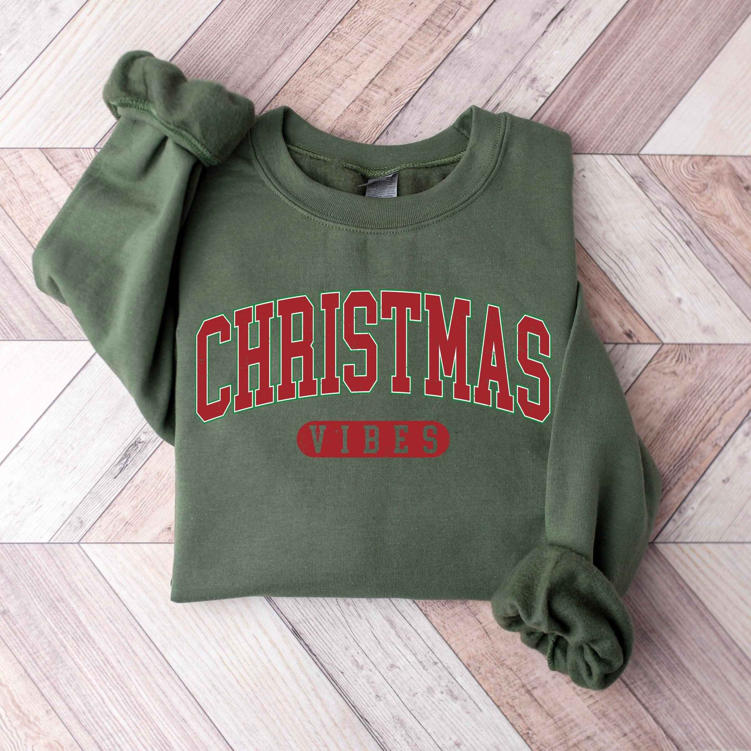 Cozy Christmas sweatshirt in customizable colors with "Christmas Vibes" text
