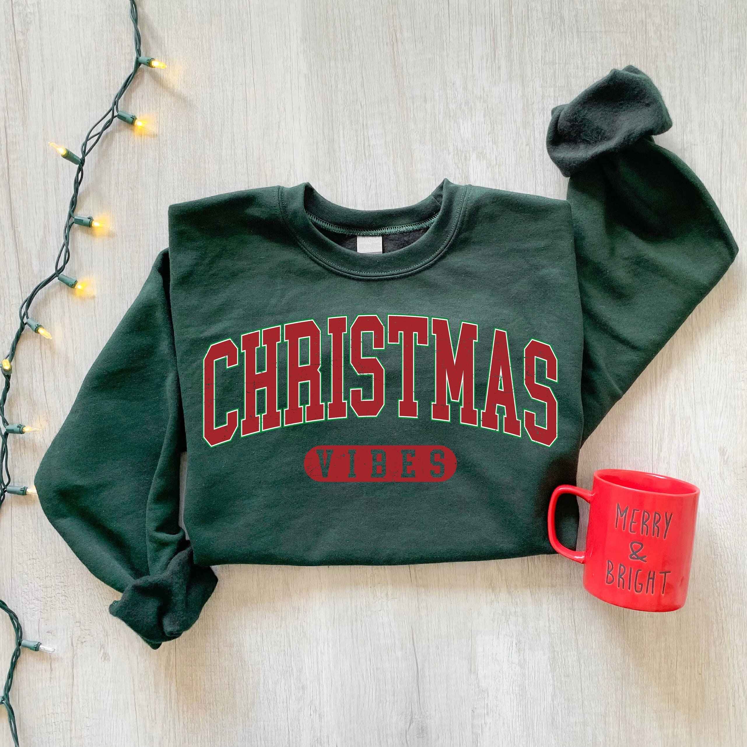 Holiday sweatshirt with bold "Christmas Vibes" design, various color options
