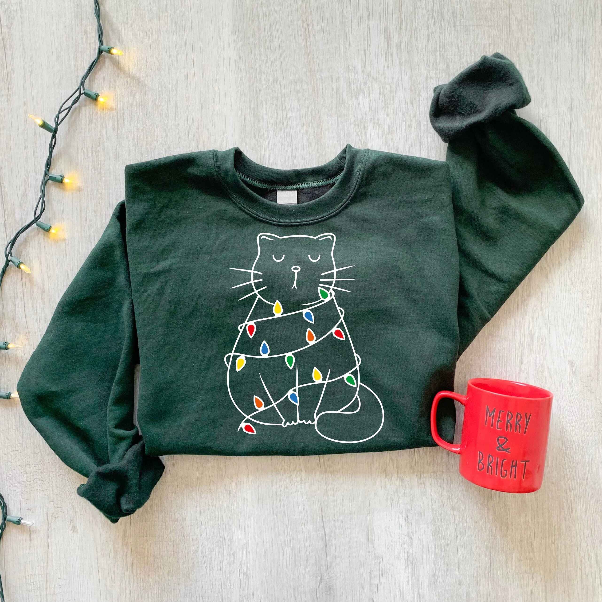 Cozy holiday sweatshirt featuring festive cat design
