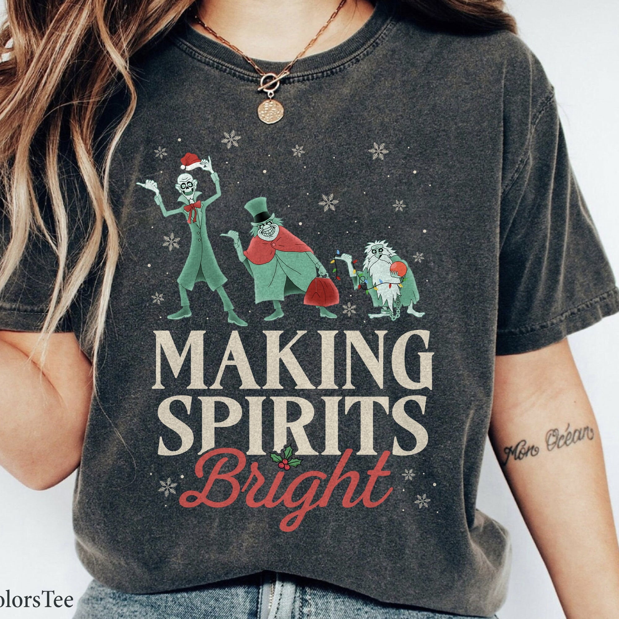 Holiday t-shirt featuring playful ghosts and festive text
