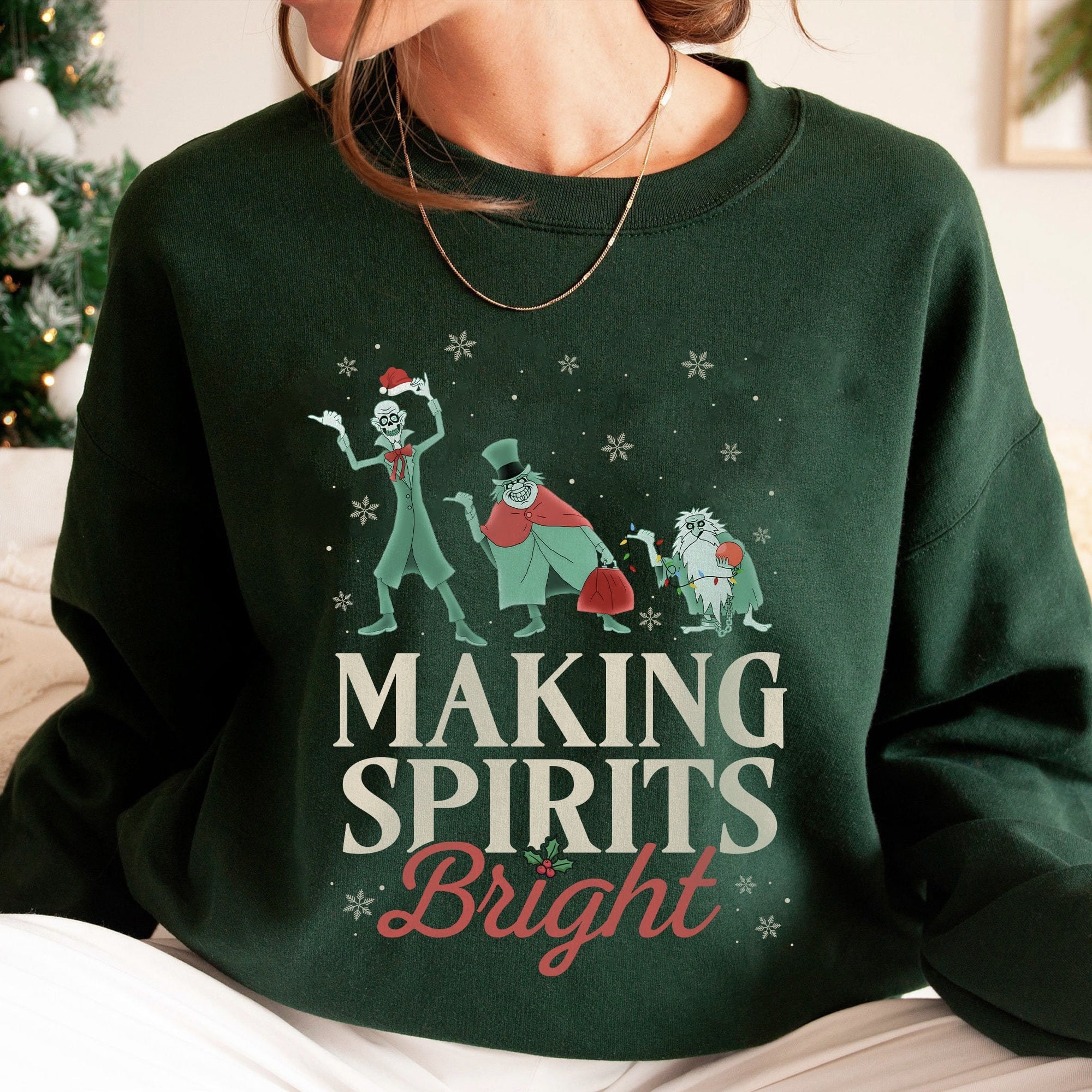 Holiday t-shirt featuring playful ghosts and festive text
