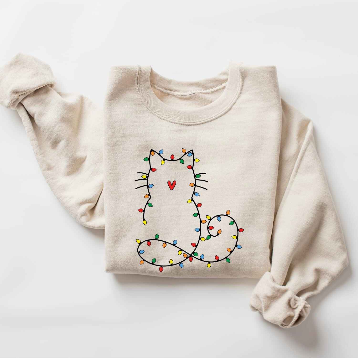 Festive holiday sweatshirt featuring a cute cat design with Christmas lights
