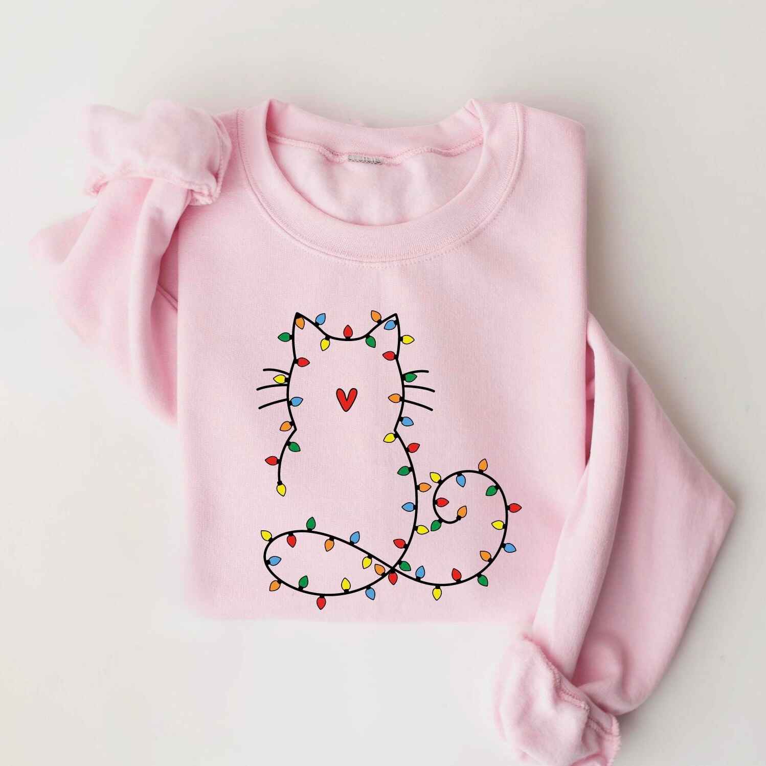 Pastel pink Christmas sweatshirt with cat outlined in holiday lights
