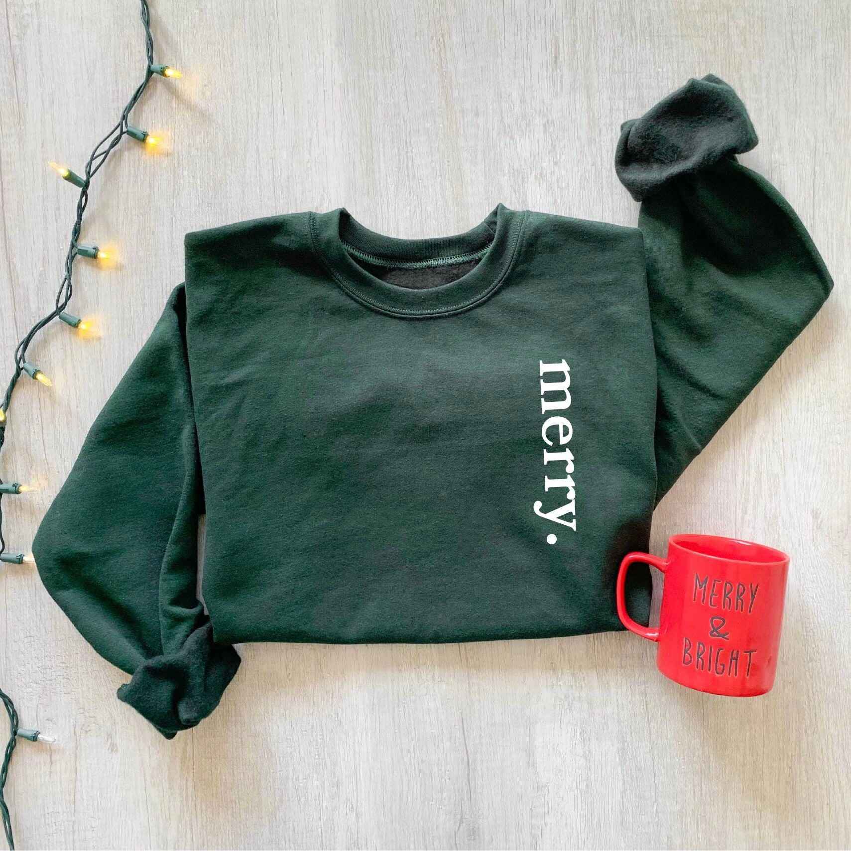 Cozy holiday sweatshirt with simple "Merry" design
