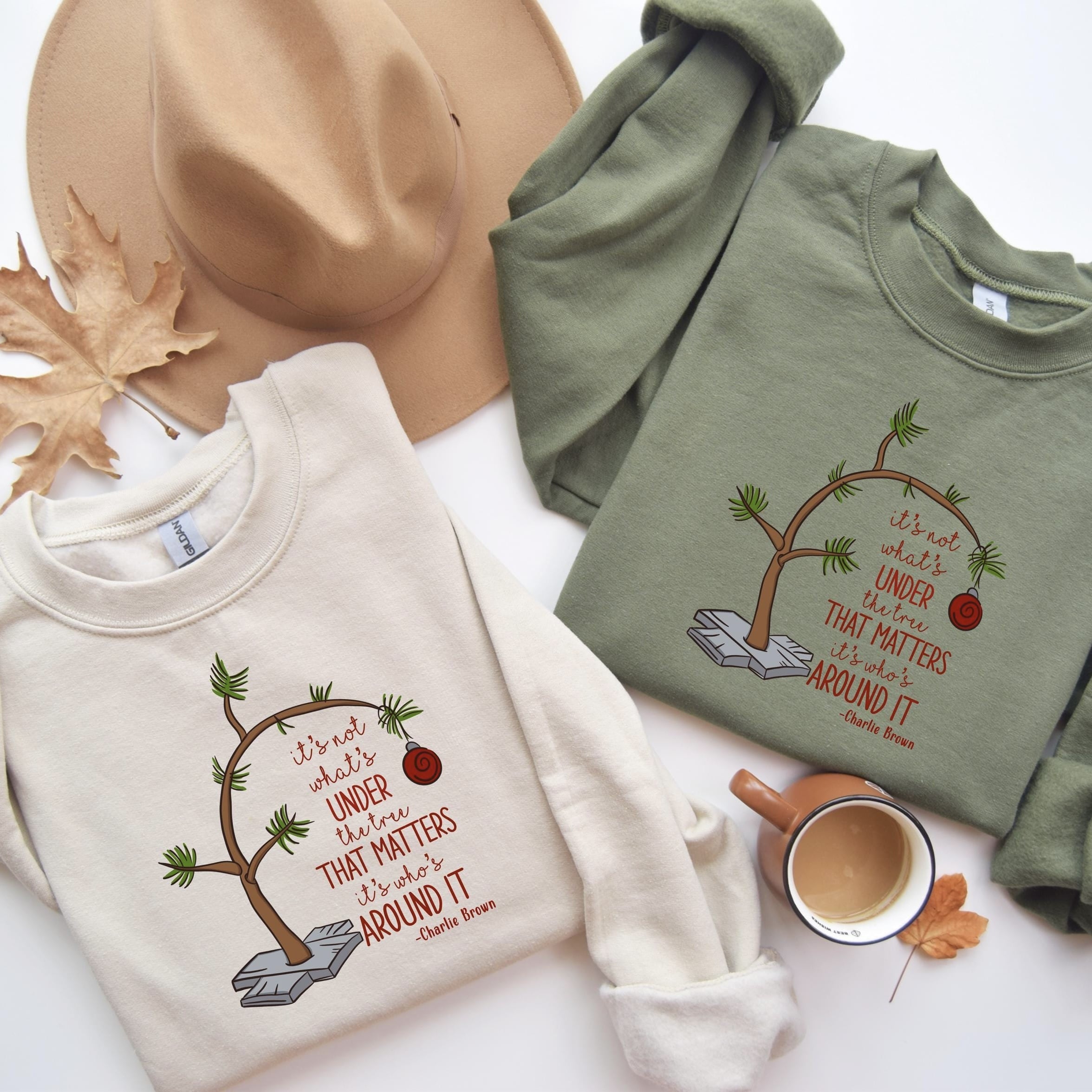 Cream holiday sweatshirt with minimalist tree design and heartfelt message about togetherness.
