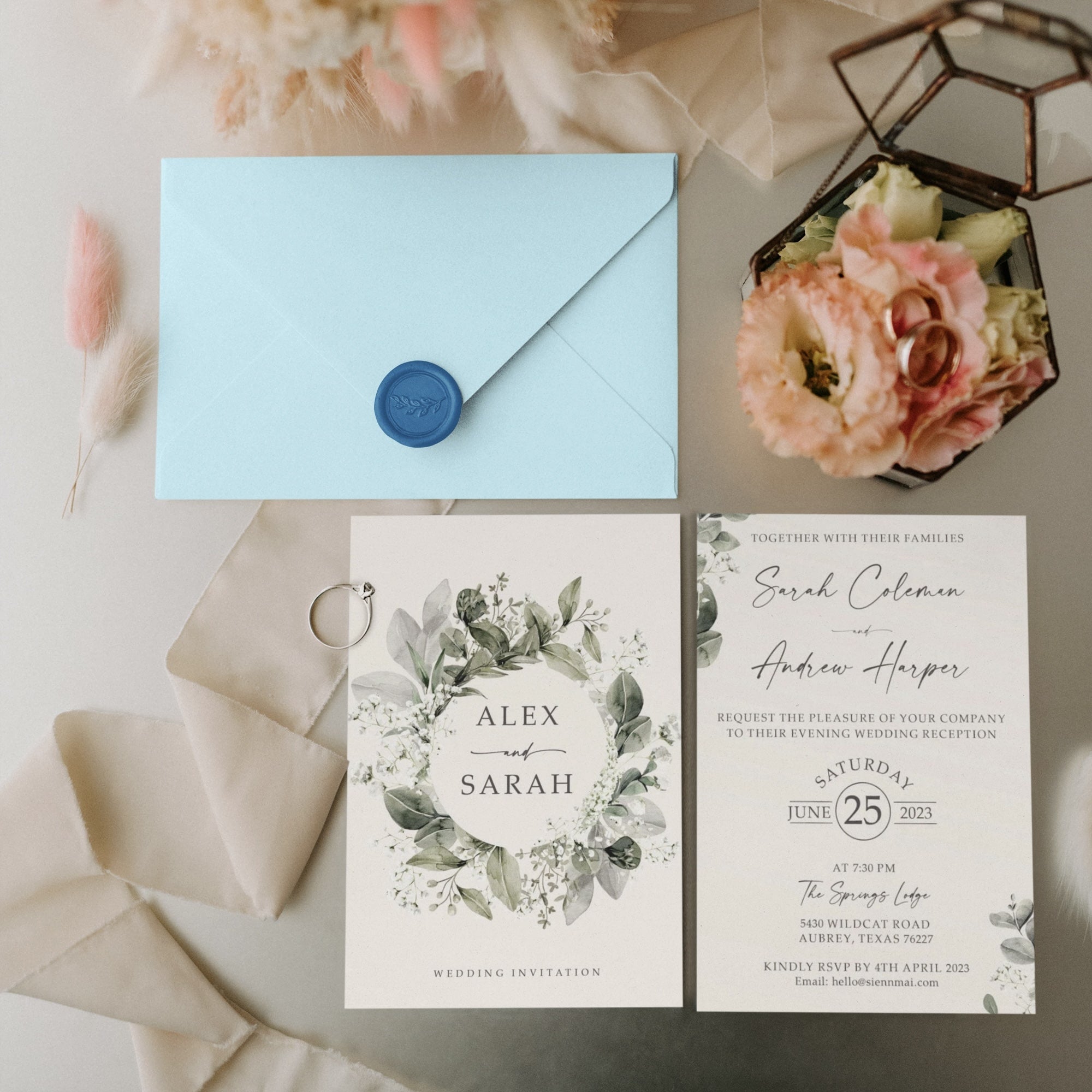 Baby’s Breath wedding invitation with sage green accents and wax seal.